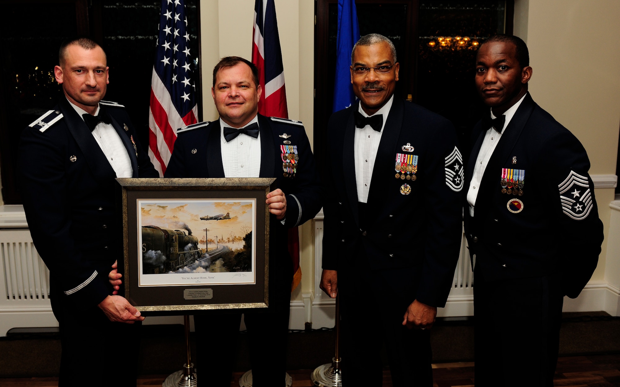 RAF ALCONBURY, United Kingdom - Lt. Col. Richard Rachal accepts the Civilian Category One of the Year Award on behalf of Dieadra Marshall during the 501st Combat Support Wing Annual Awards Ceremony Feb. 4 at RAF Alconbury. Ms. Marshall, who is assigned to the 421st Air Base Group,  was unable to attend. (U.S. Air Force photo by Tech. Sgt. John Barton)