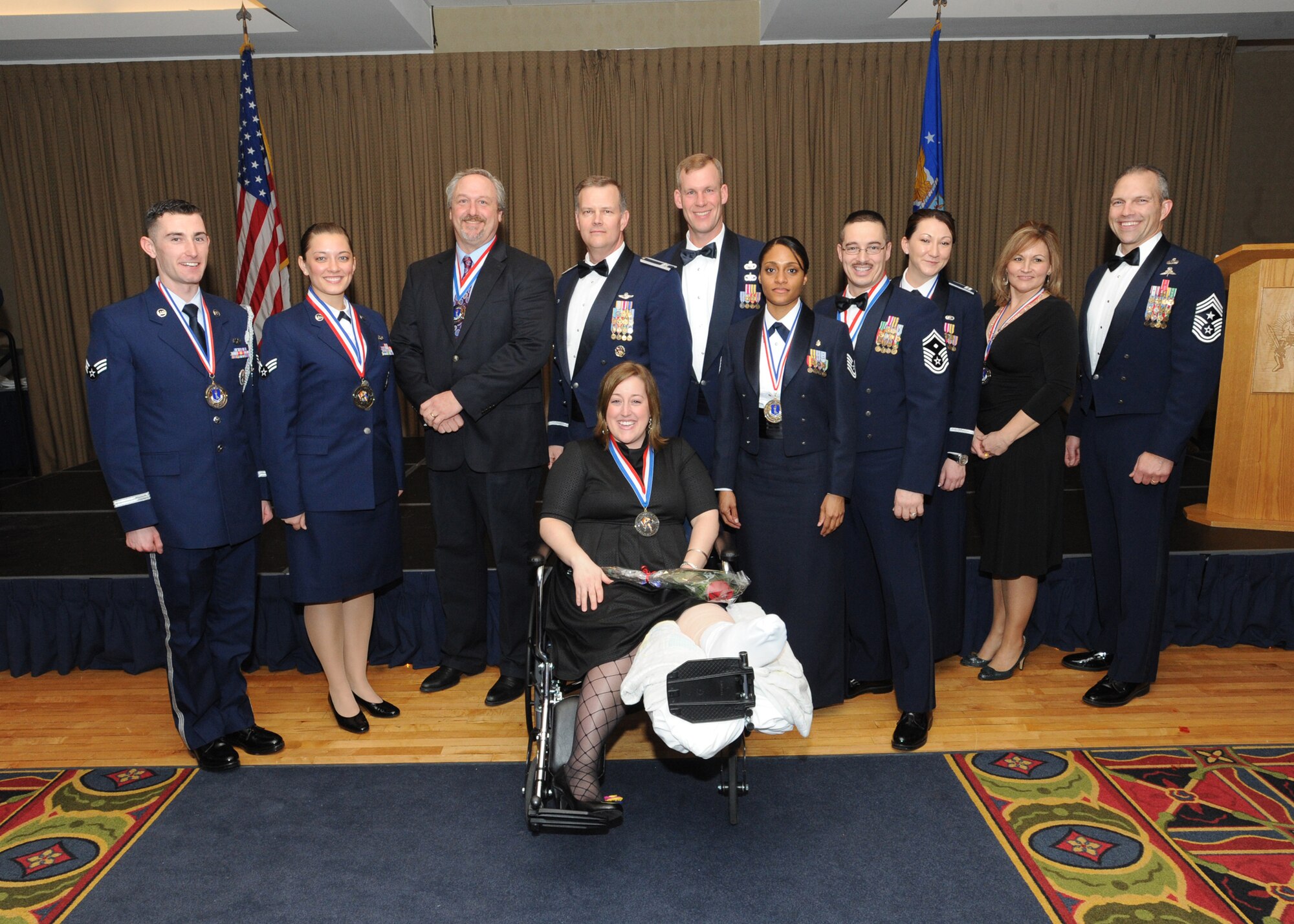Warriors of the North annual award recipients gather and pose for a group photo during the annual awards ceremony Feb. 4 at the Northern Lights Club. The annual awards are presented to recognize the most outstanding and brightest Airmen that the wing has to offer. (U.S. Air Force photo by Staff Sgt. Suellyn Nuckolls)