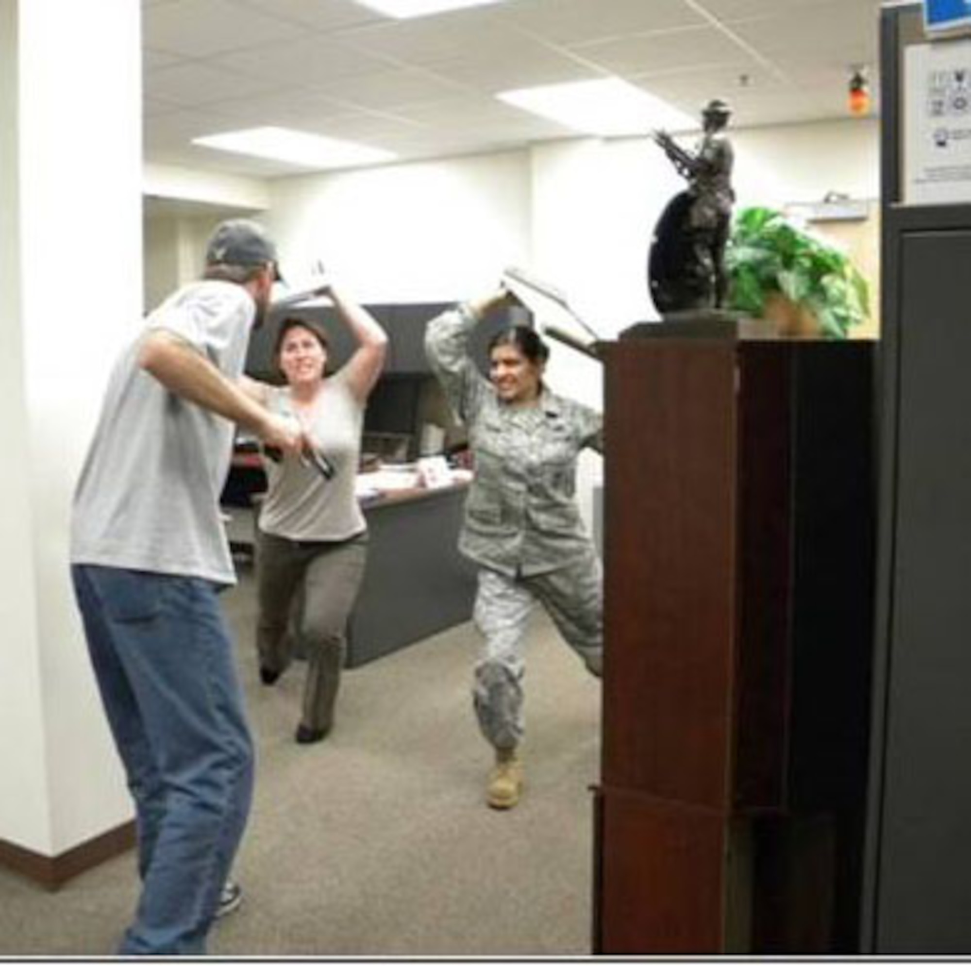 GOODFELLOW AIR FORCE BASE, Texas-- Members of Team Goodfellow attack an active shooter during an exercise. (courtesy illustration) 