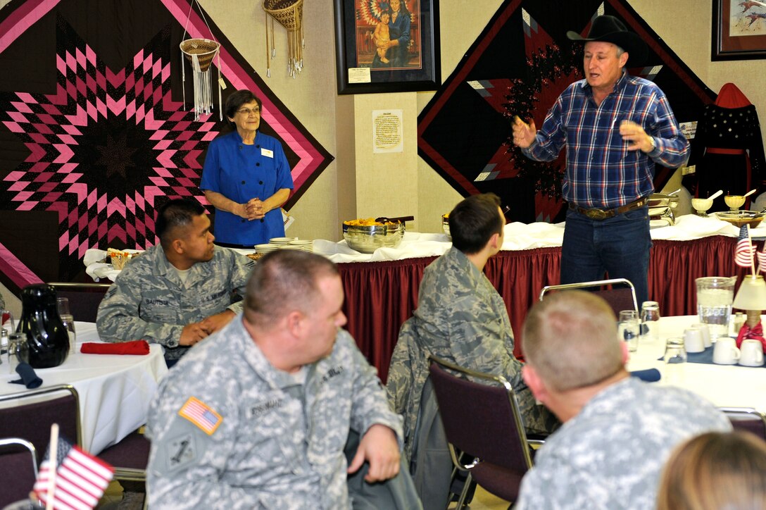 Lynn Husman, Black Hills Stock Show Foundation president, thanks Airmen from Ellsworth and soldiers from the South Dakota Army National Guard and for their military service at the Rushmore Plaza Civic Center, Rapid City, S.D., Feb. 1, 2011.  This was the eighth consecutive year the Black Hills Stock Show Foundation honored servicemembers by hosting a military appreciation luncheon. (U.S. Air Force photo/Staff Sgt. Marc I. Lane)