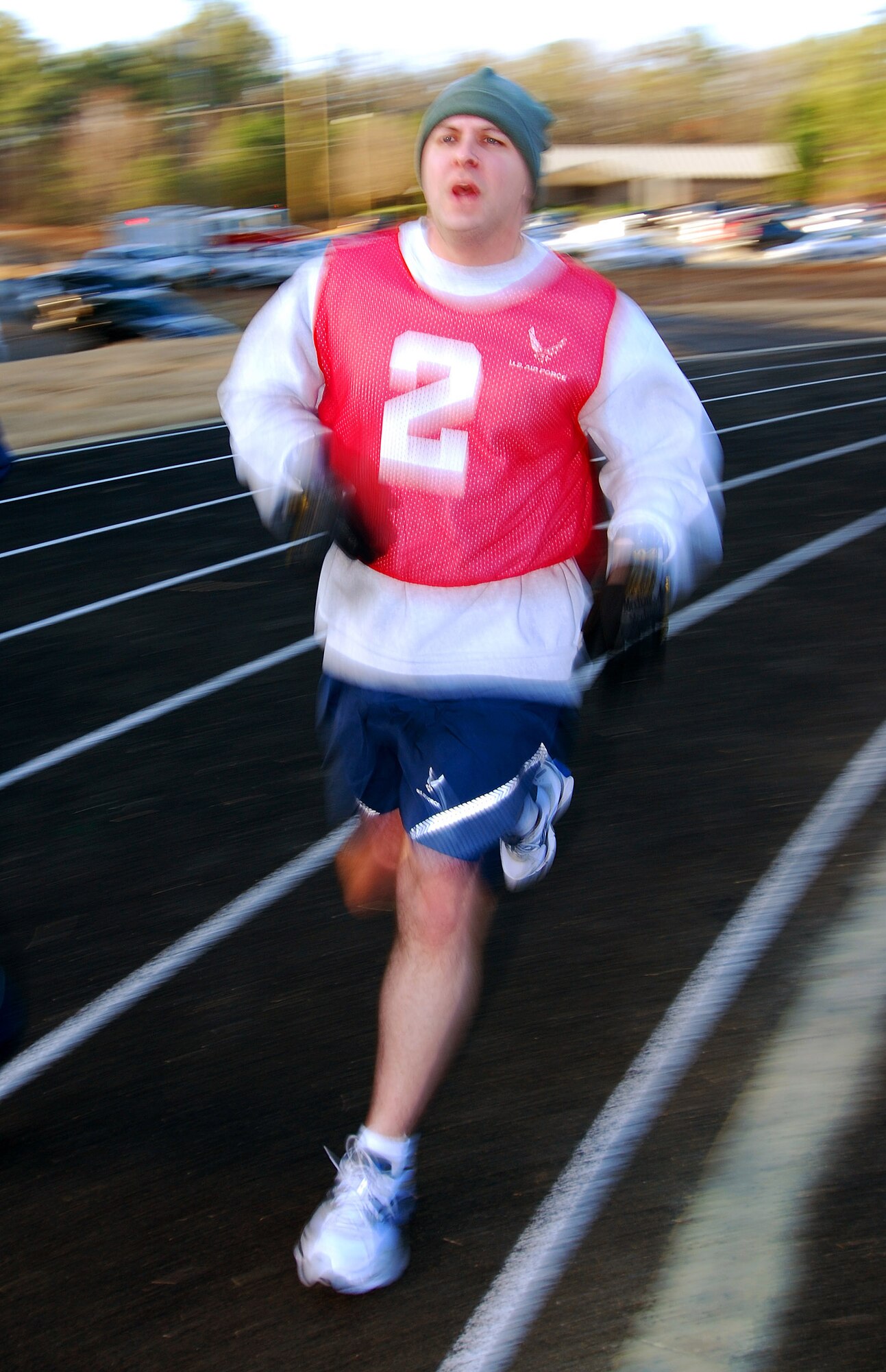 Staff Sgt. Sean Hickey from the 94th Airlift Wing Command Post charges through the mile and a half portion of his bi-annual Air Force fitness test at the new base track, 6 Feb.  The fitness test was recently revised to be administered twice a year along with some adjustments in the minimum standards.  The February Unit Training Assembly was the perfect time to test many 94th Airlift Wing members to see if they are able to meet or exceed the standards.  (U.S. Air Force photo/ Brad Fallin)