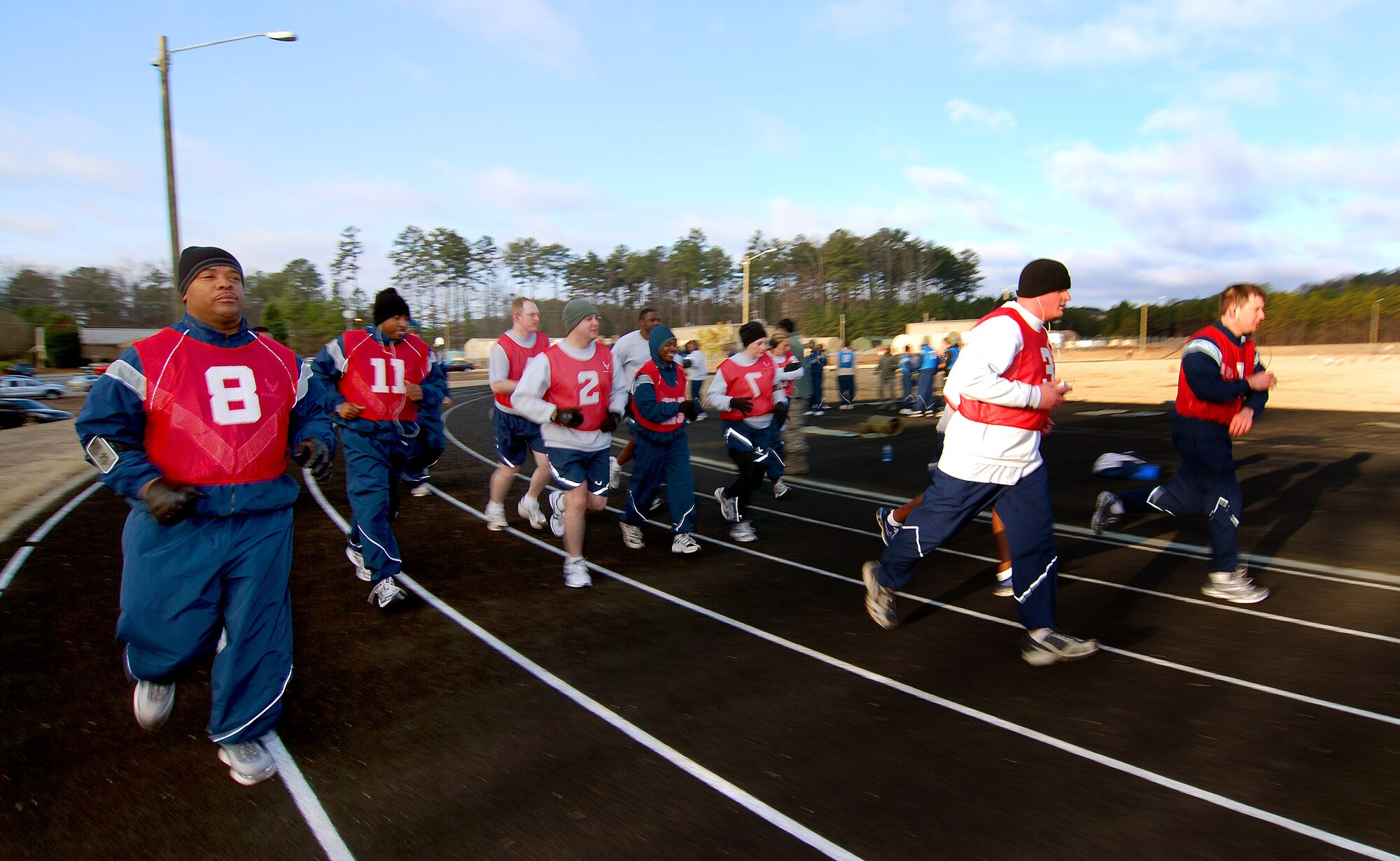 Staff personnel from the 94th Airlift Wing start the mile and a half portion of their bi-annual Air Force fitness test at the new base track, 6 Feb.  The fitness test was recently revised to be administered twice a year along with some adjustments in the minimum standards.  The February Unit Training Assembly was the perfect time to test many 94th Airlift Wing members to see if they are able to meet or exceed the standards.  (U.S. Air Force photo/ Brad Fallin)