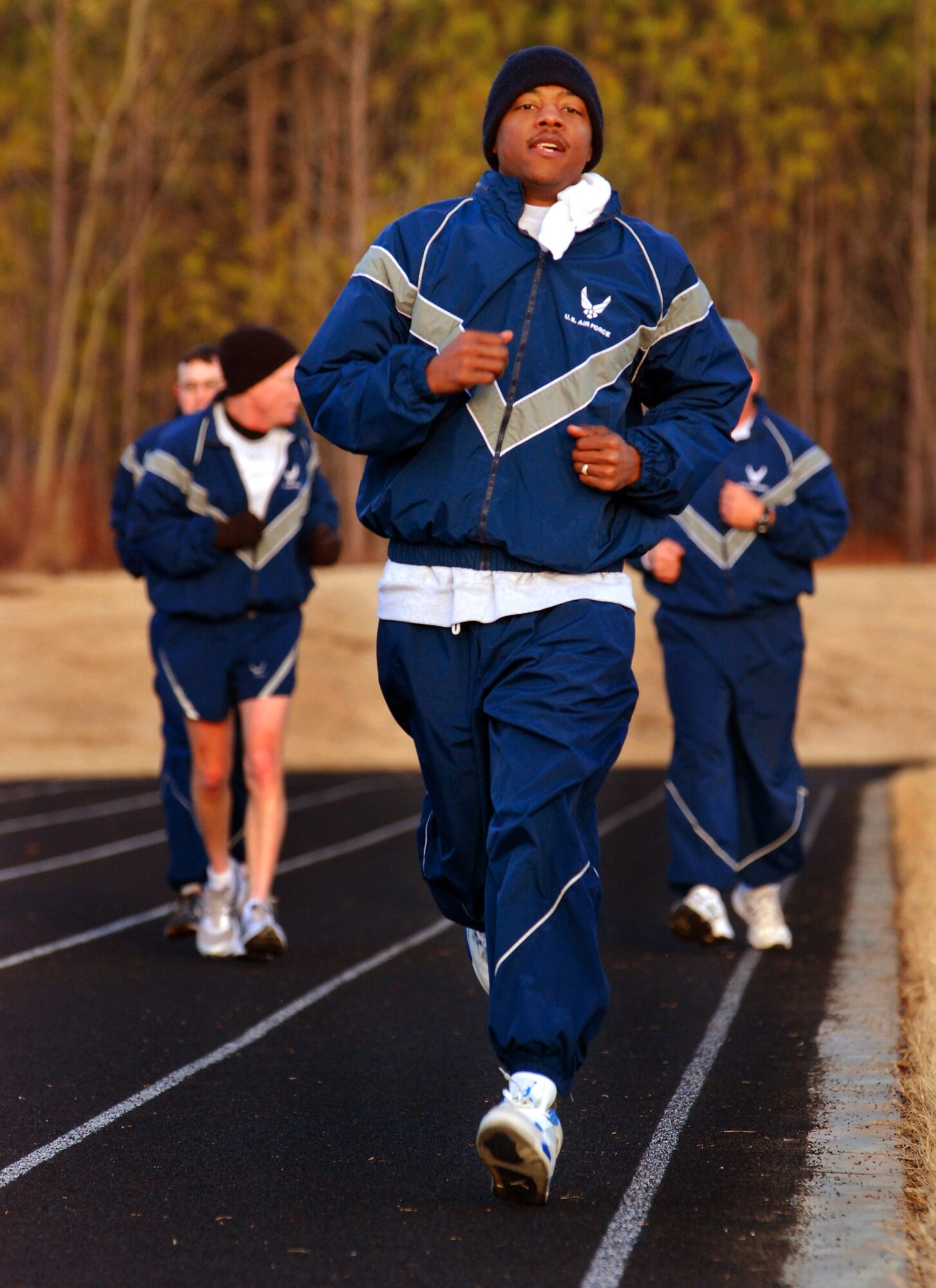 Tech Sgt. Charles Huston runs his mile and a half for the bi-annual Air Force fitness test at the new base track, 6 Feb.  The fitness test was recently revised to be administered twice a year along with some adjustments in the minimum standards.  The February Unit Training Assembly was the perfect time to test many of the 94th Airlift Wing members to see if they are able to meet or exceed the standards.  (U.S. Air Force photo/ Brad Fallin)