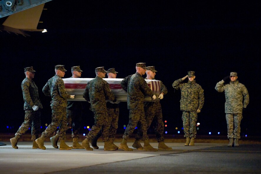 A U.S. Marine Corps carry team transfers the remains of Marine Cpl. Lucas T. Pyeatt, of West Chester, Ohio, at Dover Air Force Base, Del., Feb. 7, 2011. Pyeatt was assigned to the 2nd Radio Battalion, II Marine Expeditionary Force Headquarters Group, II Marine Expeditionary Force, Camp Lejeune, N.C.  (U.S. Air Force photo/Roland Balik)