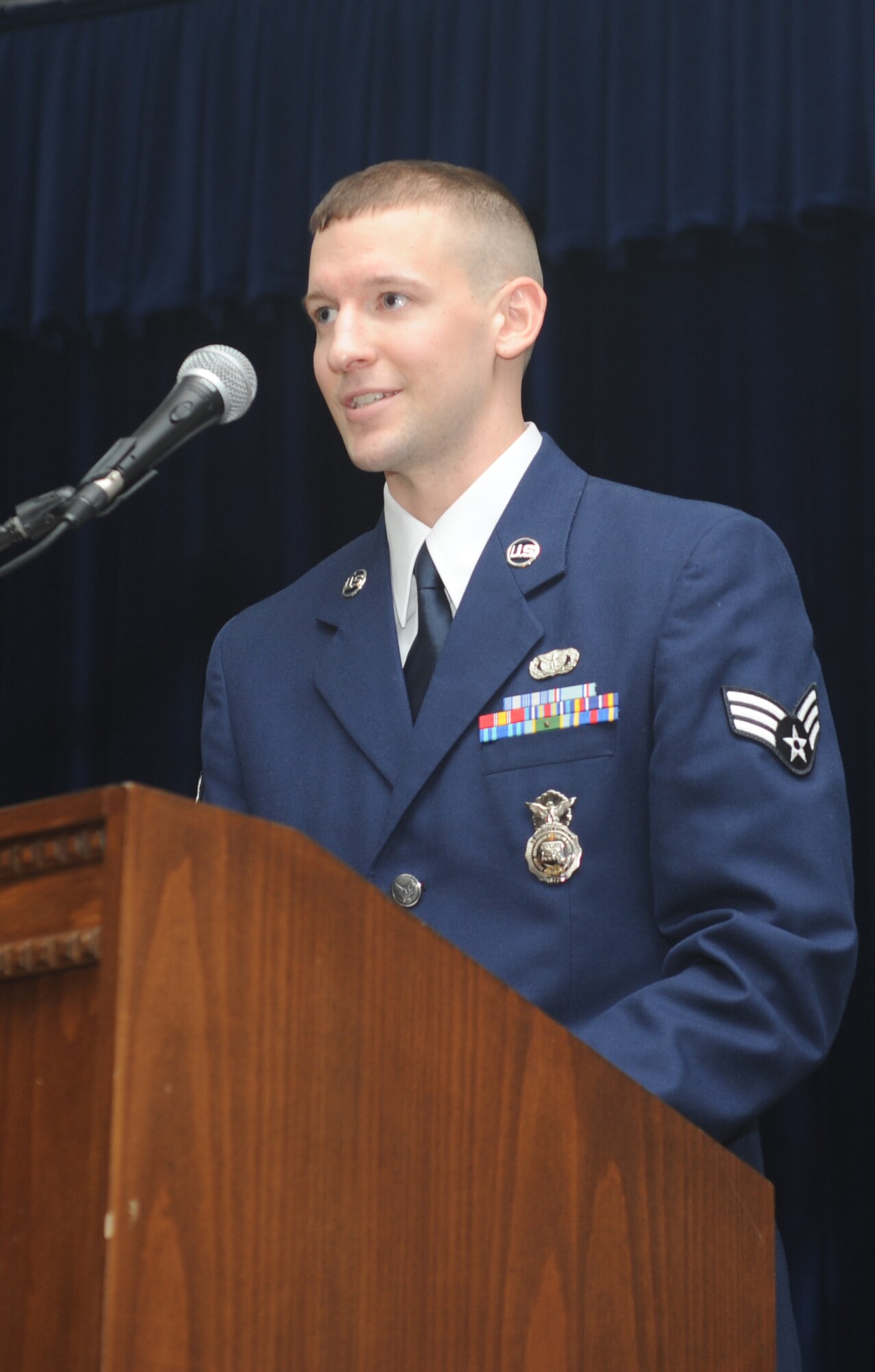 Senior Airman James Roberts, from the 39th Security Forces Squadron, gives his class final thoughts during the Airman Leadership School graduation for class 11-3 at the consolidated club Feb. 4,  at Incirlik Air Base, Turkey.  The graduates of class 11-3 were Senior Airmen Joshua Acosta, Amanda Bullock, Bradley Bunt, Garriet Canteen, Brian Cooney, Joseph Downen, Mark Hayes, John Key, Neil Kozak, Geoffrey Minton, James Roberts, Andrea Shields, George Solis, Jazzmine Van Winkle, D’Angelo Wilson and Staff Sgt. Brandon Hefner. (U.S. Air Force photo by Airman 1st Class Clayton Lenhardt/Released)