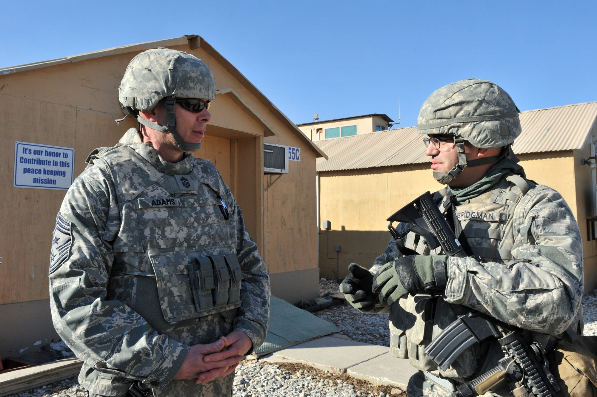 Staff Sgt. Michael Bridgman, 455th Expeditionary Security Forces Squadron, talks to Chief Master Sgt. Craig Adams, 455th Air Expeditionary Wing command chief. (Air Force photo by Senior Airman Sheila deVera) 