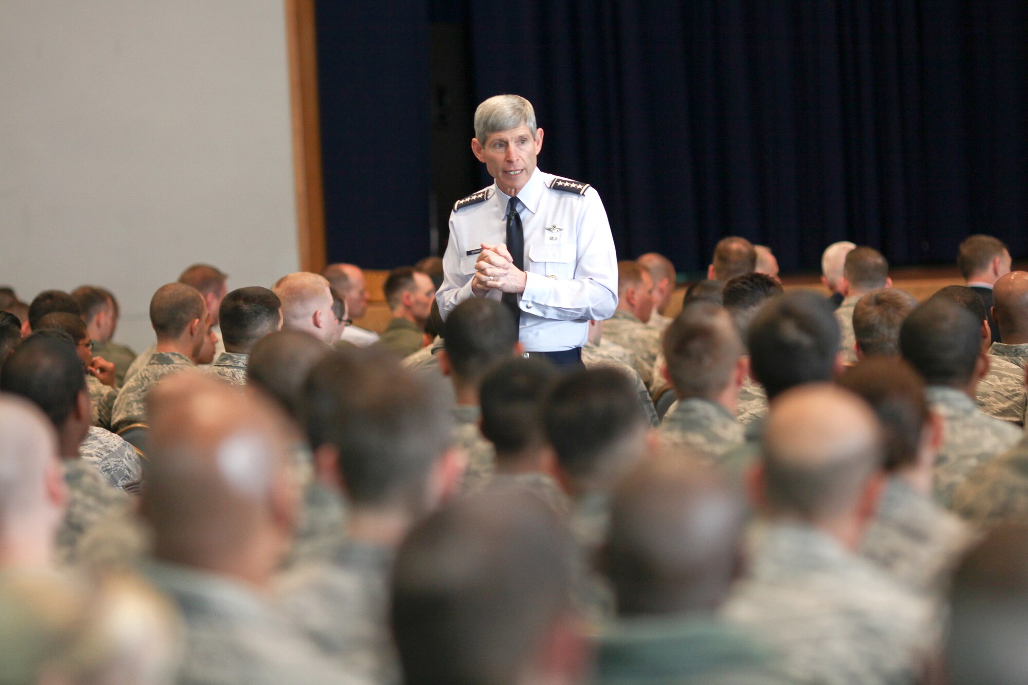 YOKOTA AIR BASE, Japan -- Air Force Chief of Staff Gen. Norton Schwartz talks with more than 600 Airmen during an Airman's call Feb. 8, 2011 at Yokota Air Base, Japan. The general spoke about his priorities for the service and fielded questions about issue affecting the Air Force in 2011. (U.S. Air Force photo/Osakabe Yasuo) 