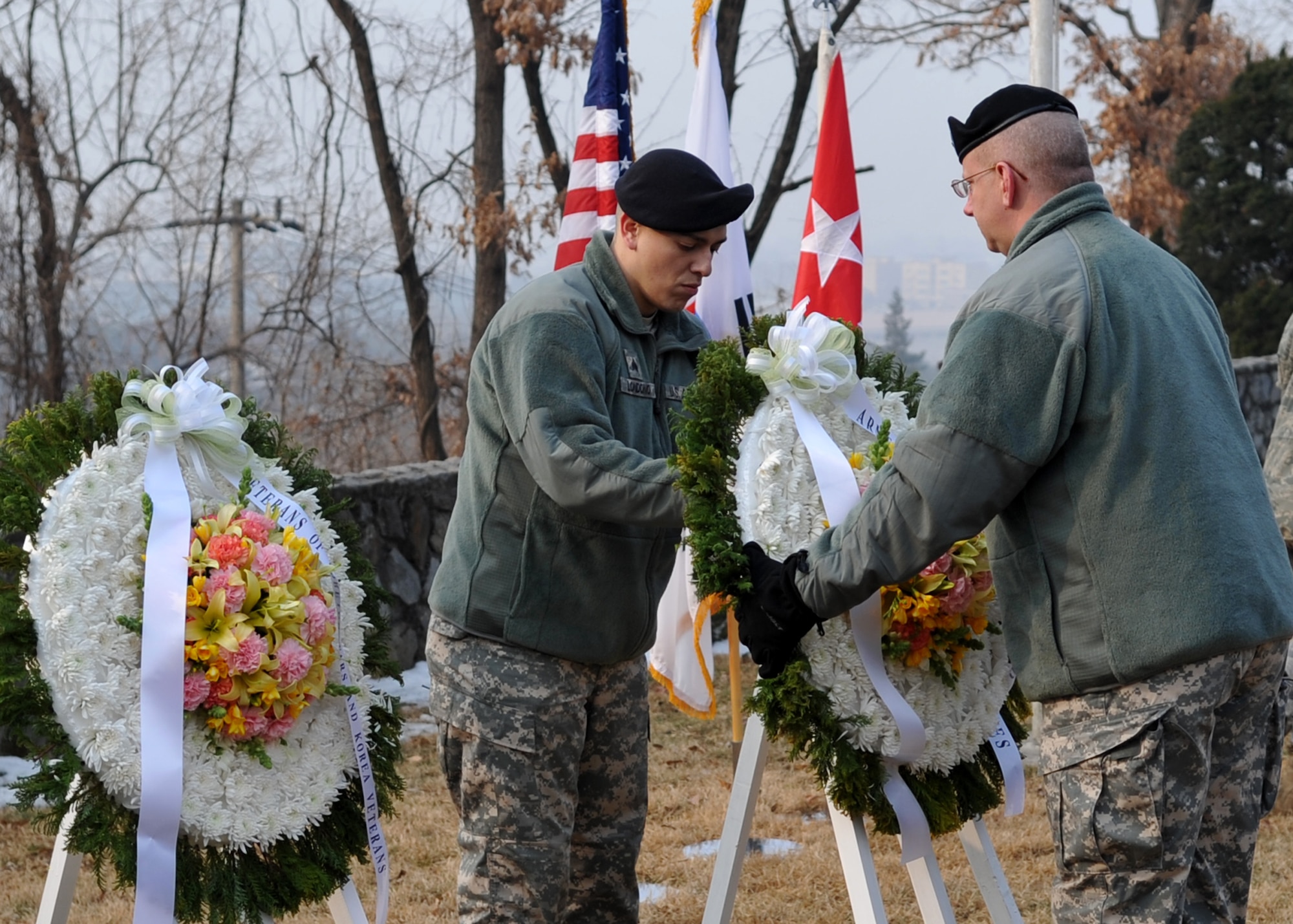 U.S. Army Soldiers lay a wreath during the 60th Anniversary "Battle of Hill 180" ceremony Feb. 8 at Osan Air Base, Republic of Korea. The ceremony paid tribute to the actions of the Soldiers of the 27th Infantry Regiment "Wolfhounds" during a bayonet charge up Hill 180 here Feb. 7, 1951. (U.S. Air Force photo/Senior Airman Evelyn Chavez)