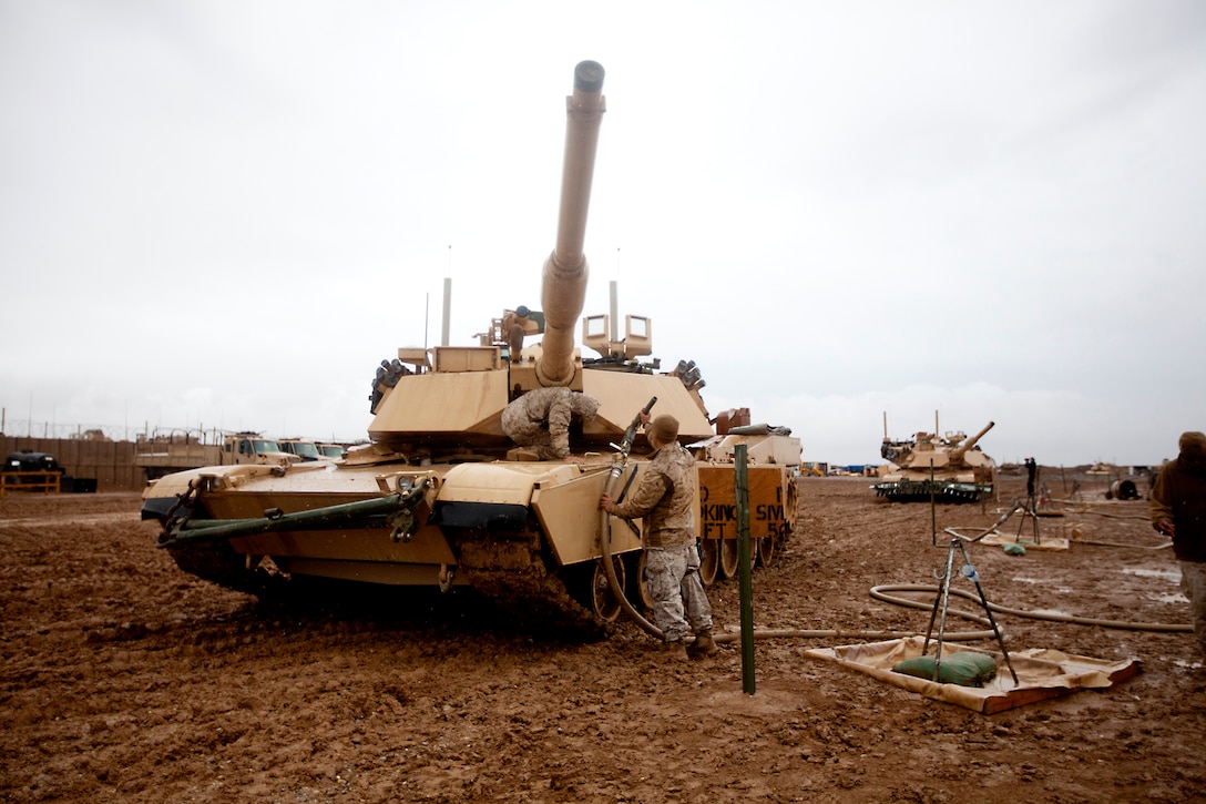 U.S. Marines refuel an M1A1 Abrams tank on Forward Operating Base Edinburgh in Helmand province, Afghanistan, Feb. 2, 2011. The Marines, assigned to the 1st Marine Division's Company D, 1st Tank Battalion, are supporting security operations throughout the province.