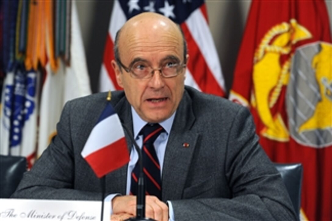 French Minister of Defense Alain Juppe responds to a reporter's question during a joint media availability in the Pentagon with Secretary of Defense Robert M. Gates on Feb. 8, 2011.  