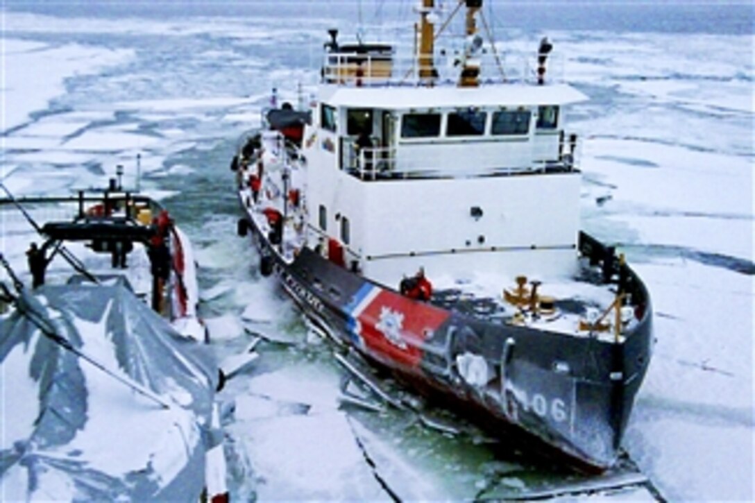 Crewmembers aboard the U.S. Coast Guard Cutter Morro Bay, a 140-foot icebreaking tug, prepare to pull alongside the Canadian coast guard ship Samuel Risley to transfer a rescued snowmobiler on Feb. 2, 2011.  The Morro Bay's crew, along with Canadian search and rescue agencies, searched an area of about 20 square nautical miles before finding the man southwest of Colchester, Ontario.  