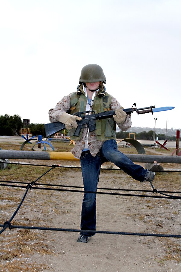 Jodi Meyerson, English teacher, American Leadership Academy, South Spanish Fork, Utah, maneuvers through a field of simulated tripwires while running the bayonet assault course Feb. 8.