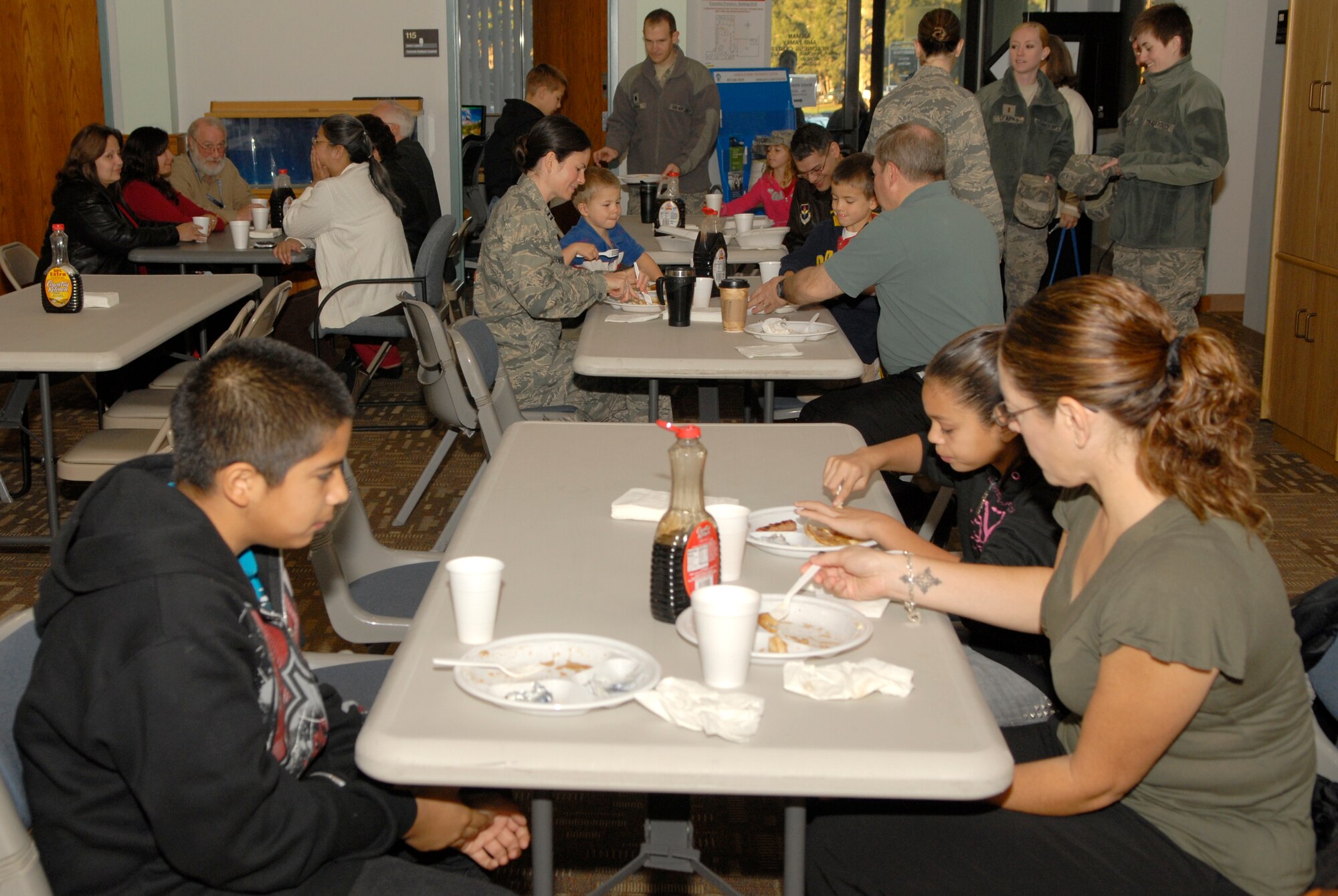 VANDENBERG AIR FORCE BASE, Calif. --  Team V members eat breakfast during the 1st Sgt.'s Council Pancake Breakfast event at the Airman and Family Readiness Center here Friday, Feb. 4, 2011.  The 1st Sgt.'s Council held the event to raise money for the Vandenberg  Food Pantry, which helps the base community.  (U.S. Air Force photo/Senior Airman Andrew Satran) 

  
 
 
 