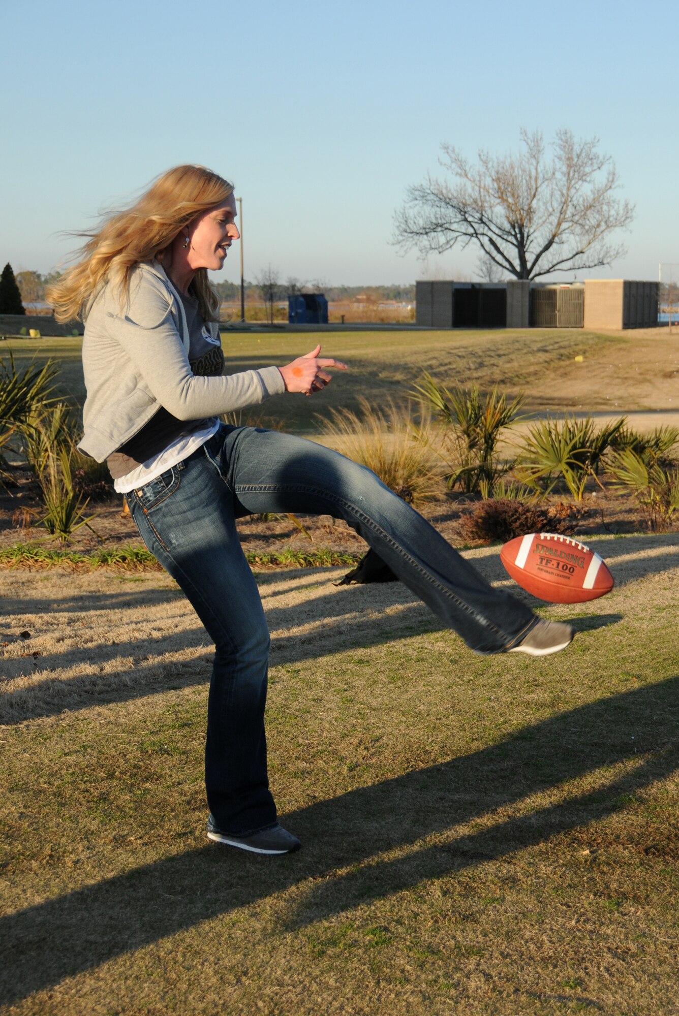 Airman 1st Class Kristina Friley, 338th Training Squadron, competes in the punt, pass and kick challenge during Sunday’s Super Bowl party at Bay Breeze Event Center.  (U.S. Air Force photo by Kemberly Groue)