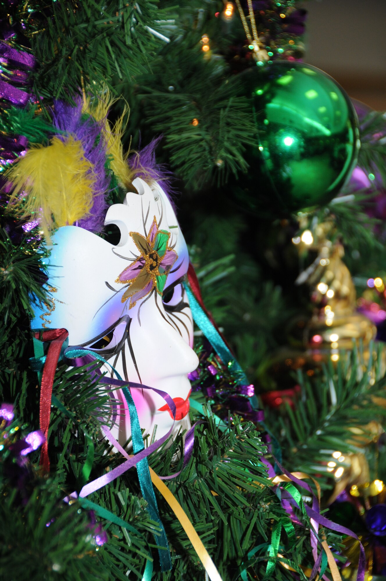 In this area, Christmas trees are often transformed into Mardi Gras trees to mark the carnival season, like this tree at the Azalea Dining Facility.  (U.S. Air Force photo by Kemberly Groue)