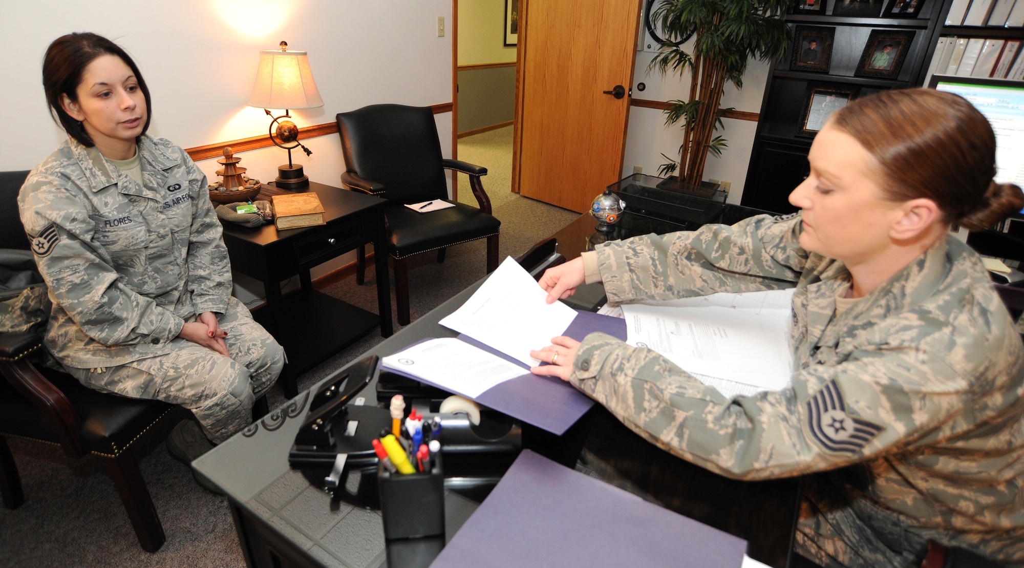 Tech. Sgt. Amanda Staggers, 22nd Air Refueling Wing legal office NCOIC, speaks to Staff Sgt. Loree Flores, 22nd Civil Engineer Squadron unaccompanied housing manager, about the job duties of a paralegal during a cross-training interview at the base legal office Feb. 8, 2011, McConnell Air Force Base, Kan. Paralegals, such as Sergeant Staggers, support all areas of the Air Force’s legal practice, including operations law, military justice, civil law and legal assistance. Enlisted members of the legal office are paralegals and officers are judge advocates. (U.S. Air Force photo/Senior Airman Maria A. Ruiz)