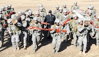 Tech. Sgt. Israel Del Toro (center) leads a class of Tactical Air Control Party students in teamwork exercises Dec. 16 at the Lackland Training Annex. (U.S. Air Force photo/Antonio Morano)