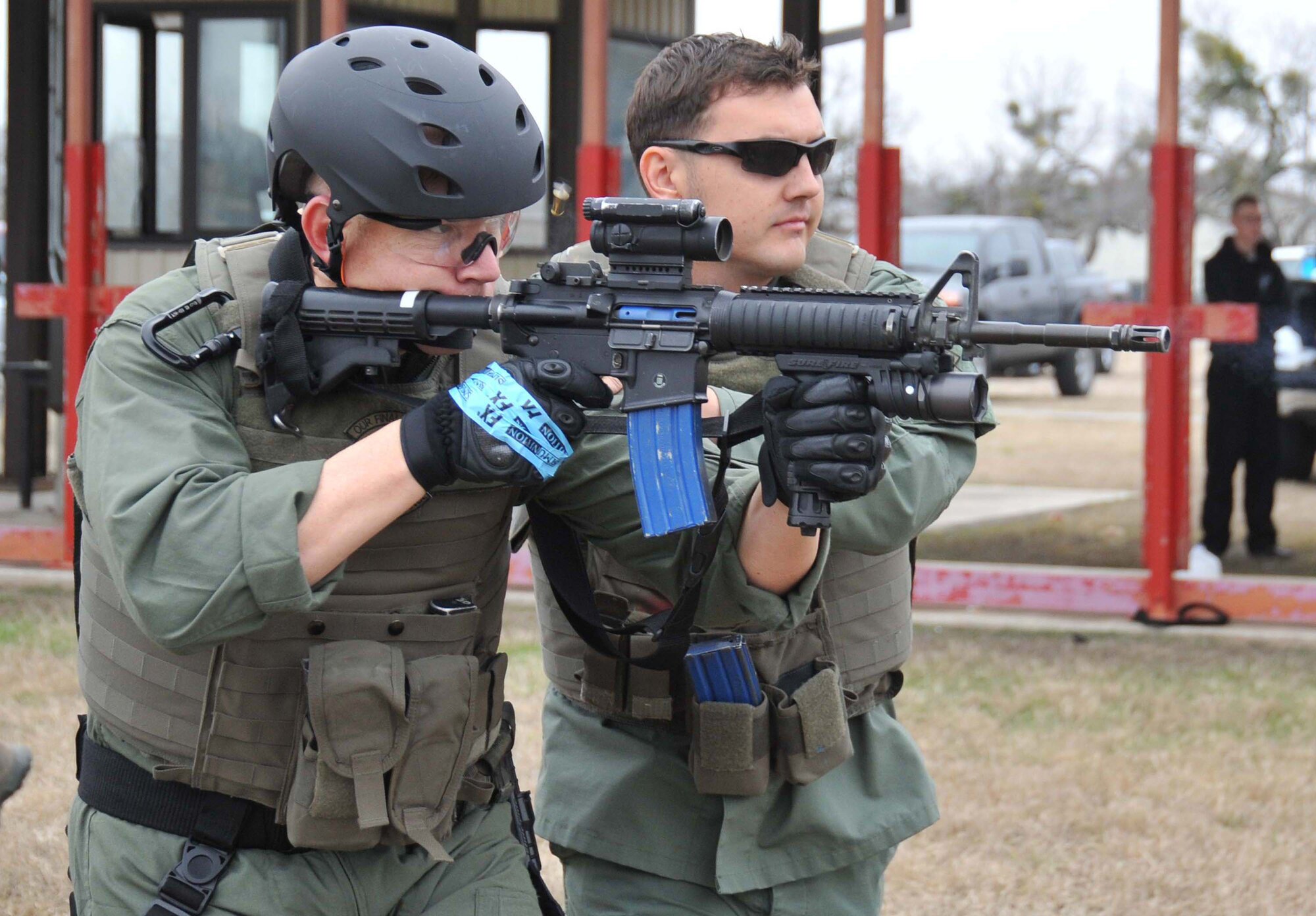 Christopher Patten, right, ensures Tech. Sgt. Nicholas Gorham, 341st Training Squadron, is using proper technique with an M4 rifle during emergency services team training Saturday at the Lackland Training Annex. Mr. Patten, 802nd Security Forces Squadron, was recently named the Air Force Security Forces outstanding civilian employee. (U.S. Air Force photo/Alan Boedeker) 
