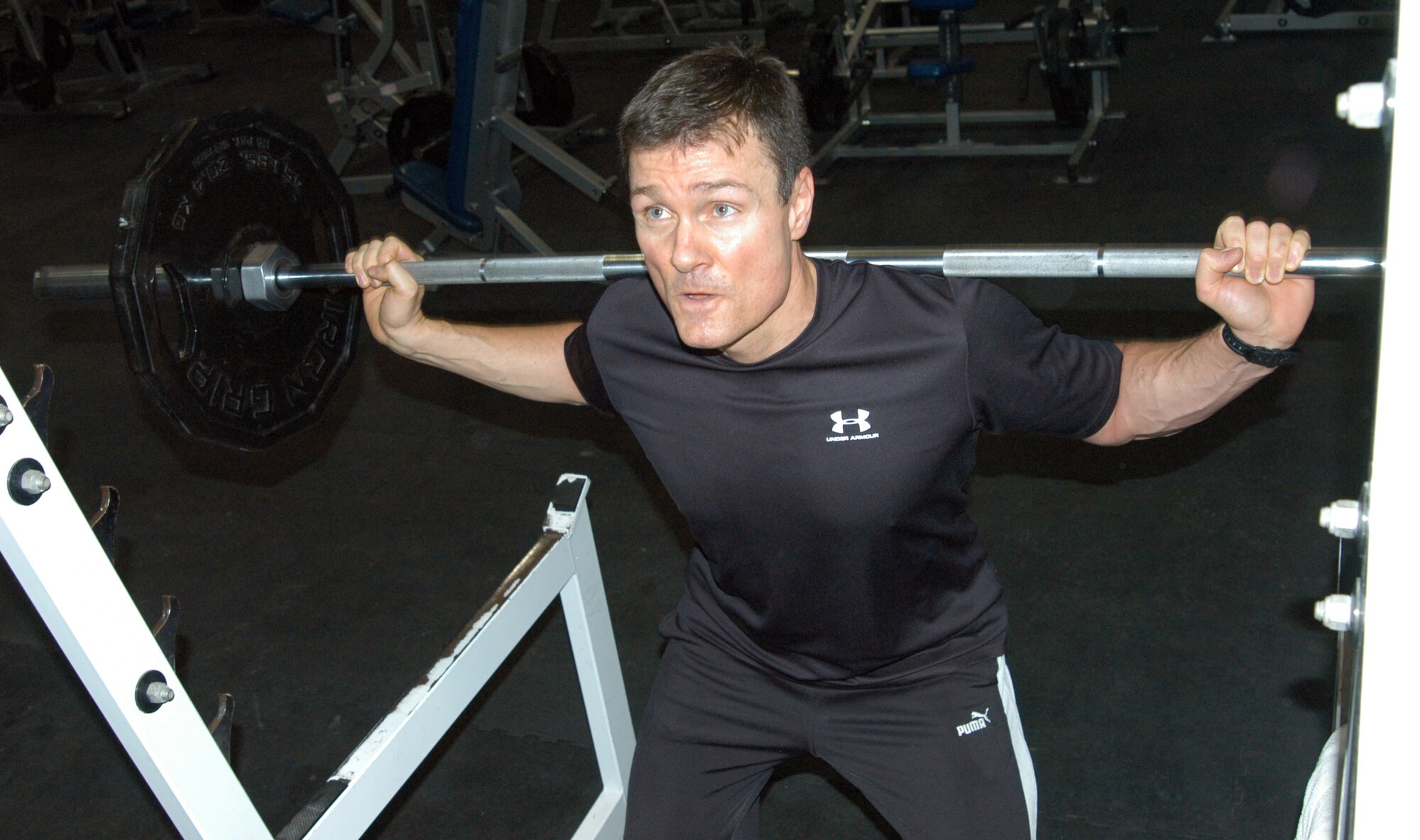 OFFUTT AIR FORCE BASE, Neb. - Jeffrey C. Ferguson, a strategic assessment analyst with U.S. Strategic Command, performs  squats at the Offutt Field House Feb. 4. Mr. Ferguson is participating in the Cold Steel Challenge and said he lifts weights regularly to stay in shape. U.S. Air Force Photo by Staff Sgt. James M. Hodgman