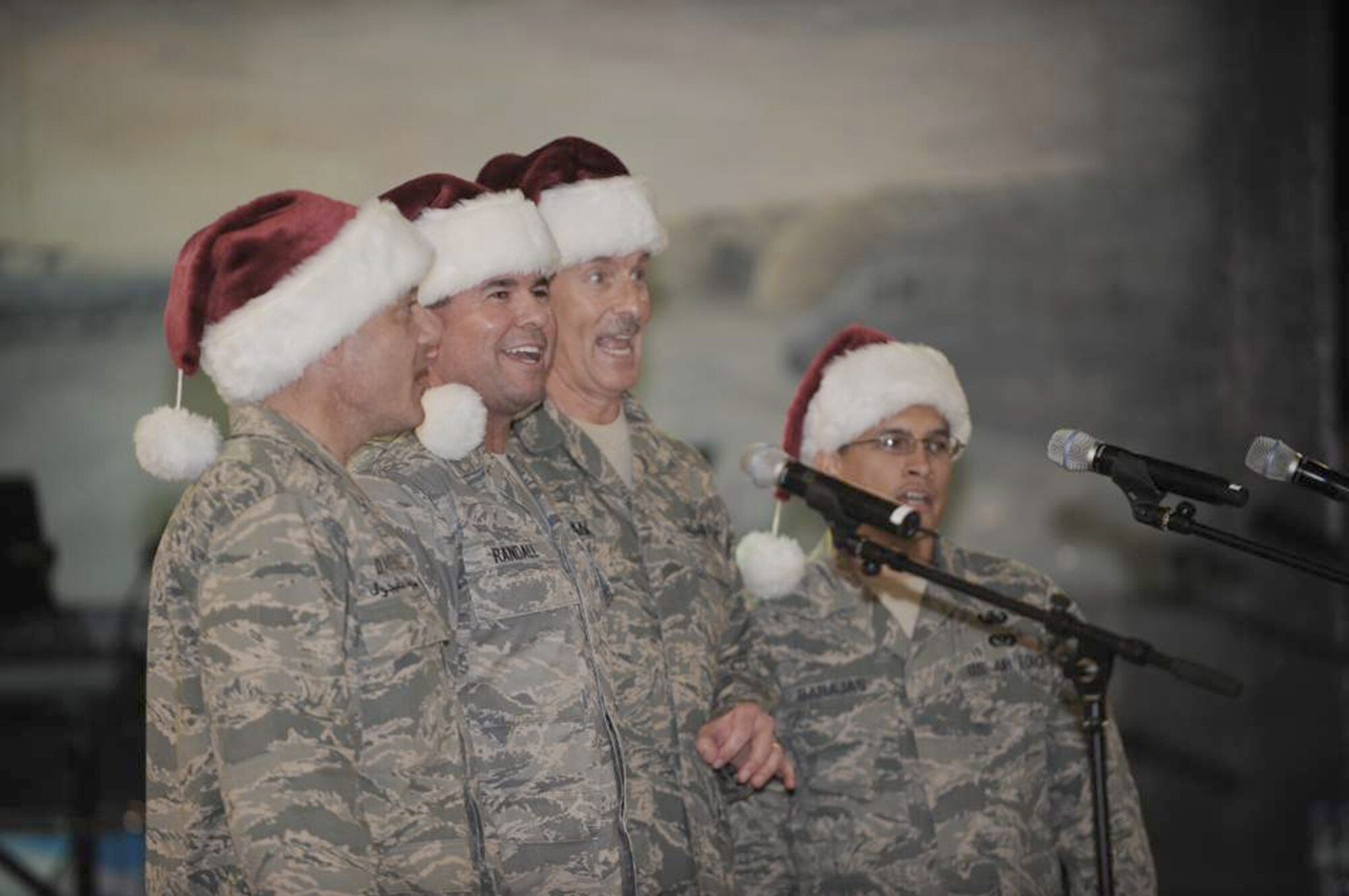 The "For God and Country" barbershop quartet sings recently on a base in Southwest Asia. The quartet is made of (from left to right) Col. Mark Danigole, (Chaplain) Capt. Sean Randall, Chief Master Sgt. Timothy Tillman and Senior Airman Chris Barajas. (Courtesy photo)
