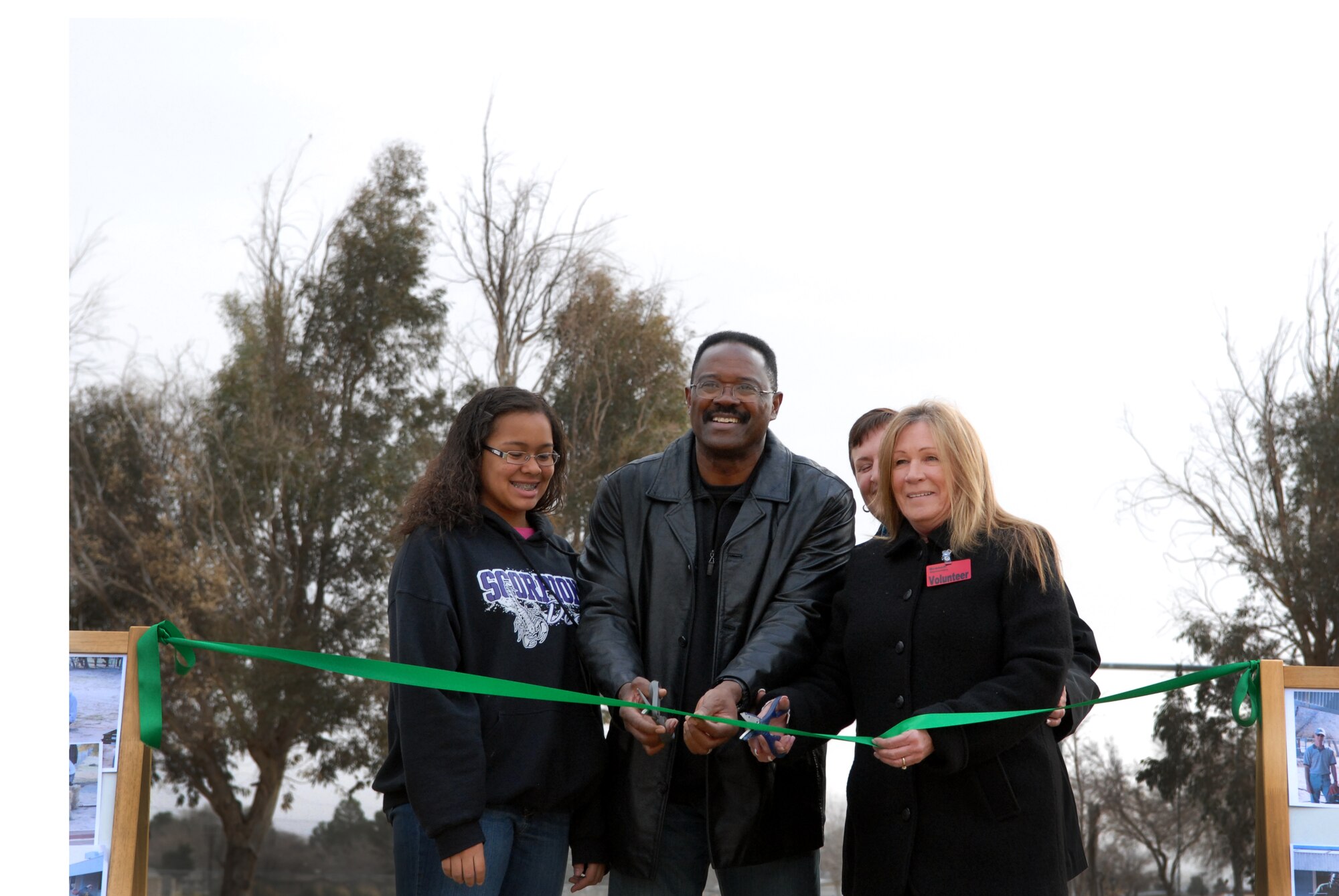 Lockheed Martin employees James Palmer (center) and Ellen Bendell (right) cut the ribbon to officially open the new outdoor classroom at Branch Elementary School. Lockheed Martin provided funding for the “Branch Garden of Learning” as part of the company's “Make a Difference Day” project. (Air Force photo by Kate Blais)