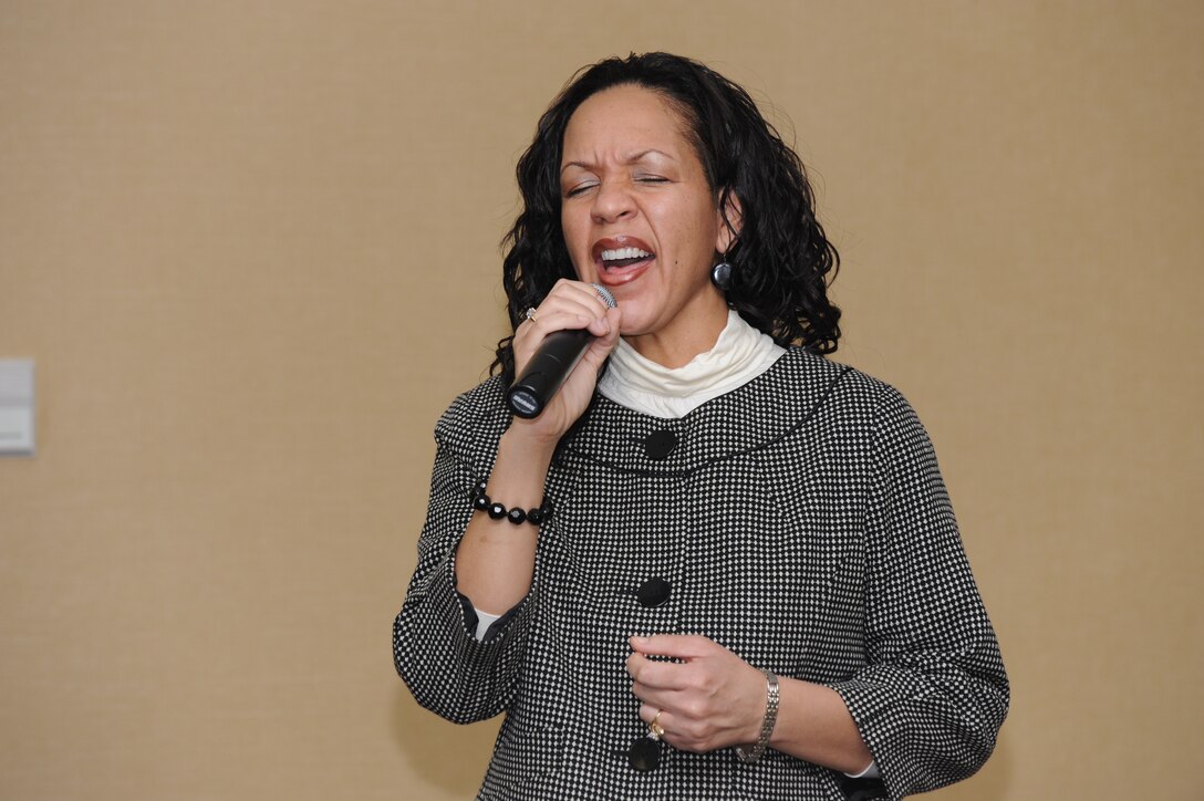 Kenleen Pringle sings "God Bless America" during the National Prayer Luncheon at Ellsworth Air Force Base, S.D., Feb. 8, 2011. The guest speaker for the luncheon was Chaplain, (Col.) Howard Stendahl, Air Combat Command command chaplain and former 28th Bomb Wing chaplain. (U.S. Air Force photo/Master Sgt. Loren Bonser)

