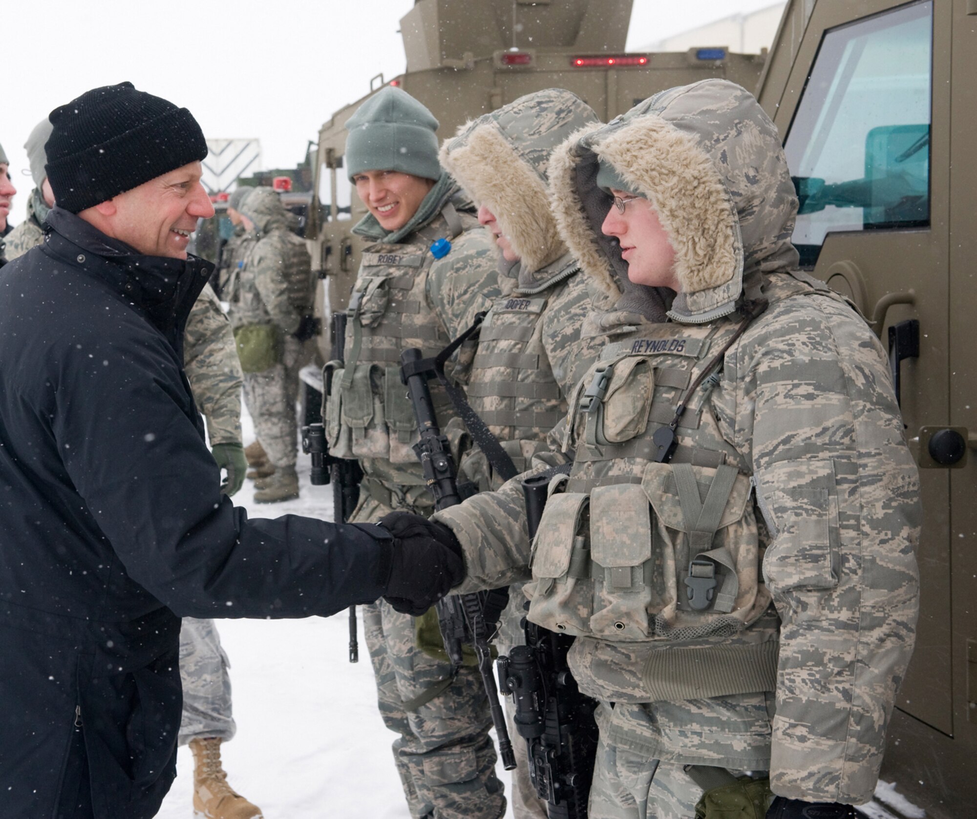 MALMSTROM AIR FORCE BASE, Mont. -- The Honorable Andrew C. Weber, Assistant
Secretary of Defense for Nuclear, Chemical and Biological Defense Programs, is greeted by Airmen 1st Class David Reynolds at the 741st Missile Security Forces Squadron Convoy Response Flight. The Secretary visited with the Airmen of the 341st Missile Wing here Feb. 6-8, calling ICBMs "an enduring mission."  Secretary Weber also talked with the local news media and met with area civic leaders. (U.S. Air Force photo/Beau Wade)
