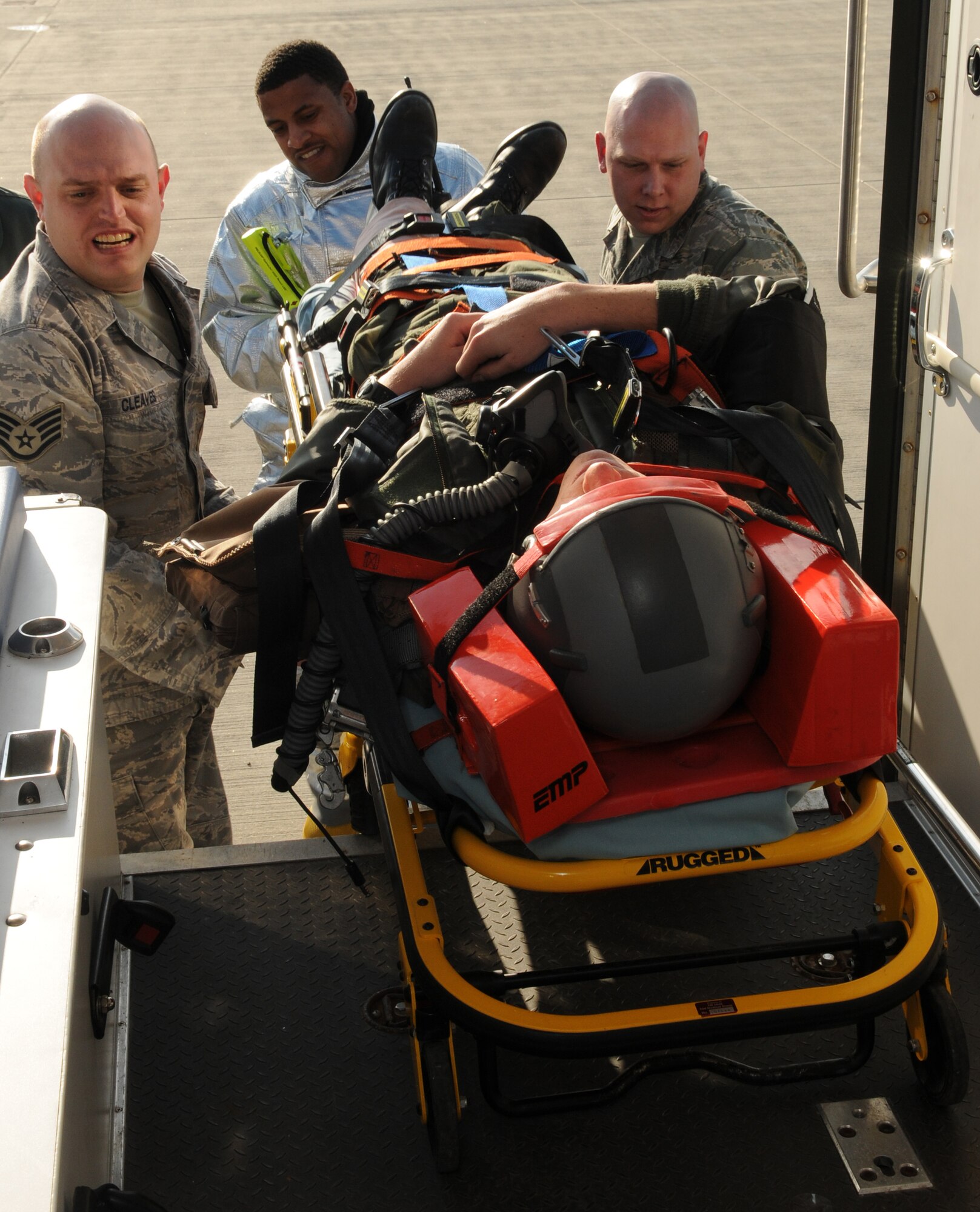 SPANGDAHLEM AIR BASE, Germany – First responders hoist an A-10 Thunderbolt II pilot into an ambulance during a major accident response exercise Feb. 8. The exercise tested base members’ ability to respond to an emergency involving aircraft on the flightline. (U.S. Air Force photo/Staff Sgt. Benjamin Wilson)