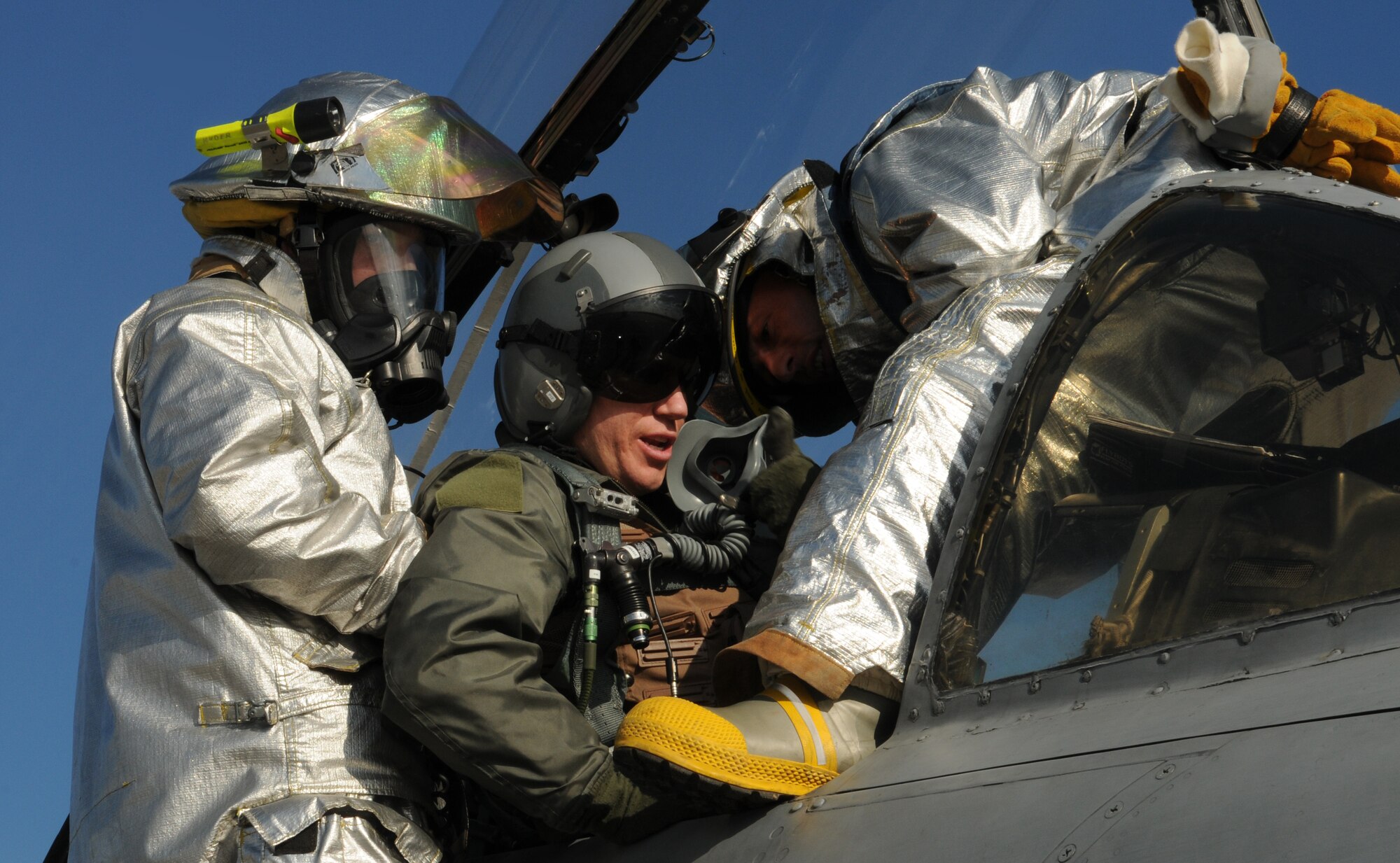 SPANGDAHLEM AIR BASE, Germany – Firefighters from the 52nd Civil Engineer Squadron extract an A-10 Thunderbolt II pilot from the flight deck during a major accident response exercise Feb. 8. The exercise tested base members’ ability to respond to an emergency involving aircraft on the flightline. (U.S. Air Force photo/Staff Sgt. Benjamin Wilson)