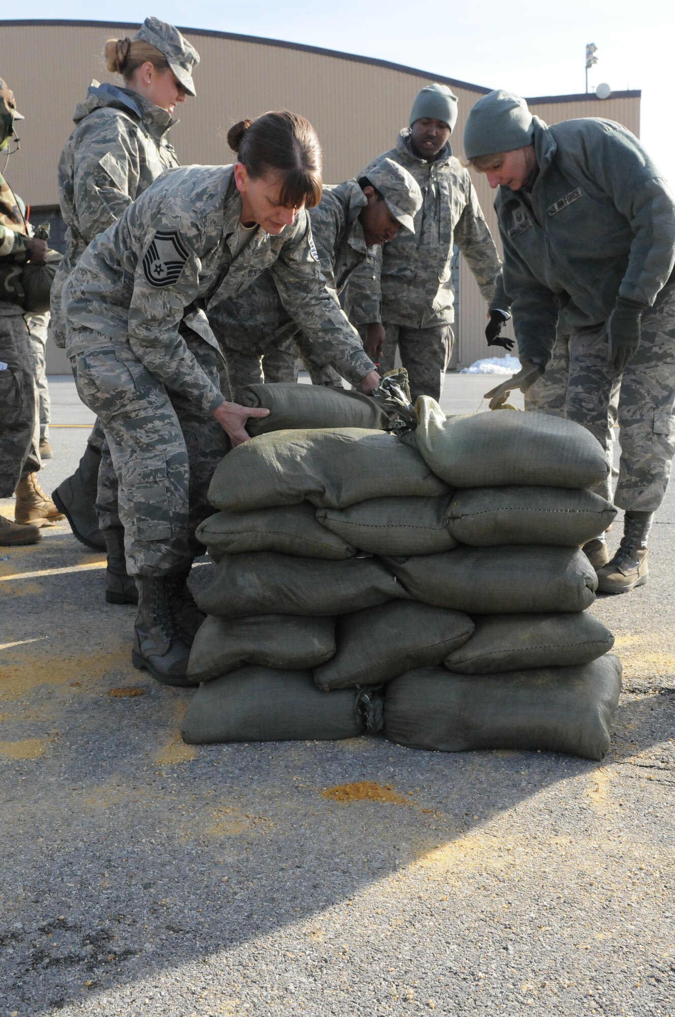JOINT BASE ANDREWS, Md. -- Airmen from the 459th Air Refueling Wing practice building sandbag bunkers here Feb. 3 during a Ability to Survive and Operate training course. The Reserve servicemembers attended 14 different training courses over a two-day period that was focused on preparing them for future exercises and an upcoming Operational Readiness Inspection. Along with the ATSO course, the training also included items like how to identify unexploded ordinance, gas mask inpections and M-16 operations. (U.S. Air Force photo/Tech. Sgt. Steve Lewis) 