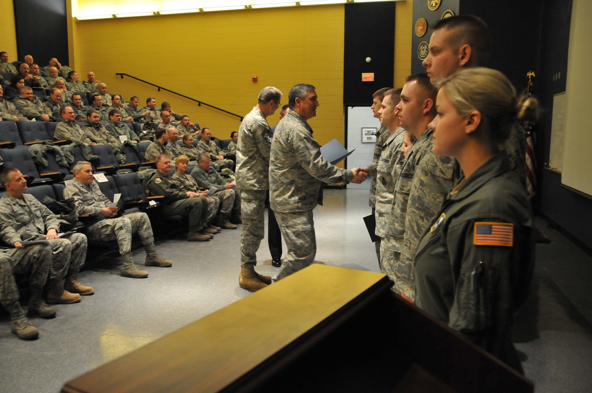 Col. Darrell G. Young, 934th Airlift Wing commander, and Chief Master Sgt. Mark Koenig, 934th Airlift Wing command chief congratulate new Noncomissioned Officers at the NCO recognition ceremony Jan. 5. (Air Force Photo/Tech. Sgt. Bob Sommer)