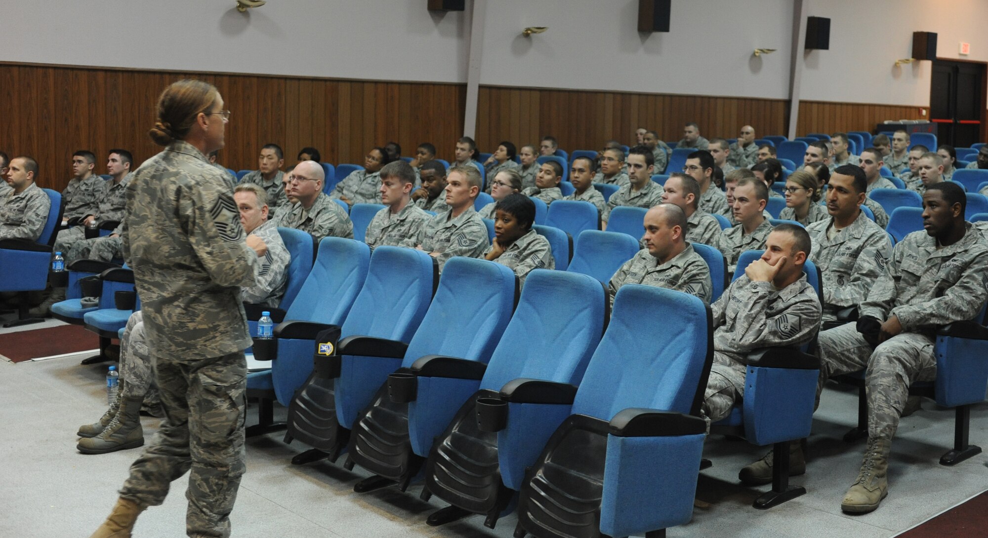Chief Master Sgt. Judith Siano, from the Airman Assignments branch at the Air Force Personnel Center, speaks to servicemembers at the base theater, Jan. 28, 2011. The briefing was part of the AFPC “Spread The Word” tour, and was intended to educate Airmen about personnel programs and to get feedback from about Airmen in the field to ensure personnel center officials are meeting their mission of putting the right people in the right place at the right time. (U.S. Air Force Photo by Airman 1st Class Clayton Lenhardt/Released)