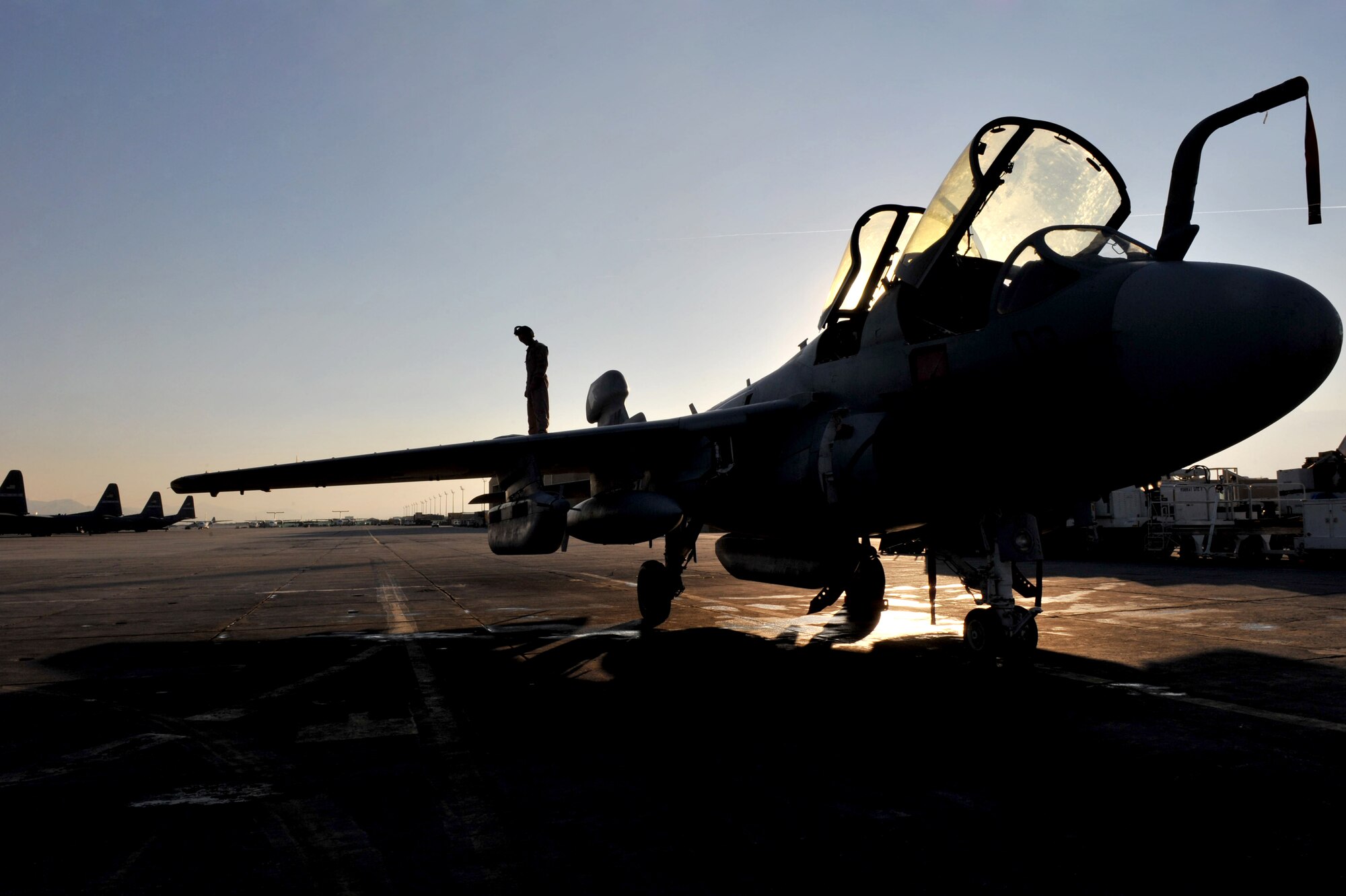 Sergeant Nick Cooley, a powerline mechanic, does a turn-around inspection on an EA-6B Prowler electronic warfare aircraft to make sure it is a safe to fly at Bagram Airfield, Afghanistan, Feb. 8, 2011. Sergeant Cooley is assigned to Marine Tactical Electronic Warfare Squadron 3. (Air Force photo by Senior Airman Sheila deVera)