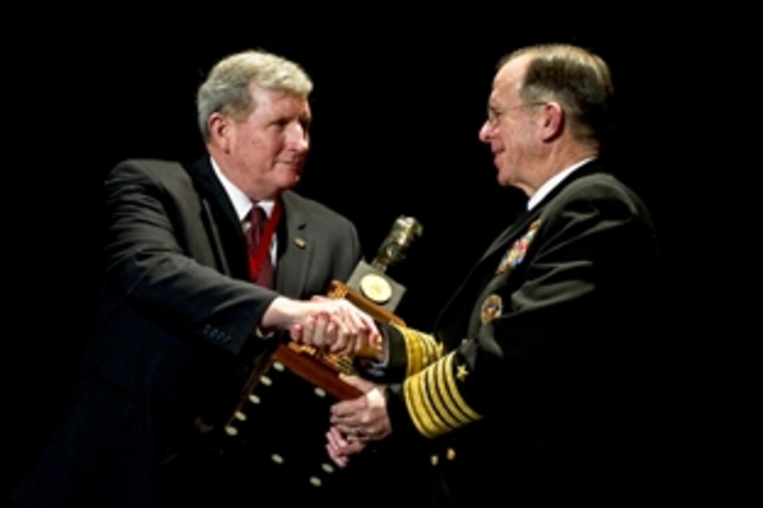 Navy Adm. Mike Mullen, chairman of the Joint Chiefs of Staff, presents the R. Lynn Rylander Award to retired Army Gen. Peter J. Schoomaker at the 22nd Annual Special Operations/Low Intensity Conflict Symposium Banquet in Washington, D.C., Feb. 8, 2011. The Rylander Award honors an individual who has made distinctive contributions to the areas of special operations or low intensity conflict.