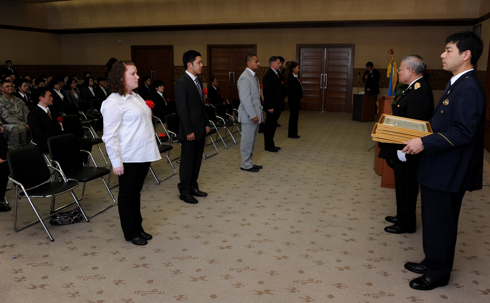 Three members from the 18th Security Forces Squadron, Kadena Air Base, were among those presented with a letter of appreciation from Mr. Akira Namihira, Senior Police Superintendent, Director of Community Safety Department, at the Okinawa Prefectural Police Headquarters in Naha, Okinawa, Feb. 10. 

The crime prevention program was established by the Juvenile Section of the Okinawa Prefecture Police along with the collaboration and support of the 18th SFS. Working together, 18th SFS and OPP have provided crime prevention classes to more than 500 students with the goal of informing and educating school-aged children about crime prevention and crime standards both on and off base. As a result, the crime rate involving juvenile, SOFA-status personnel has gone down both on and off base. 
 (U.S. Air Force Photo/Junko Kinjo) 
