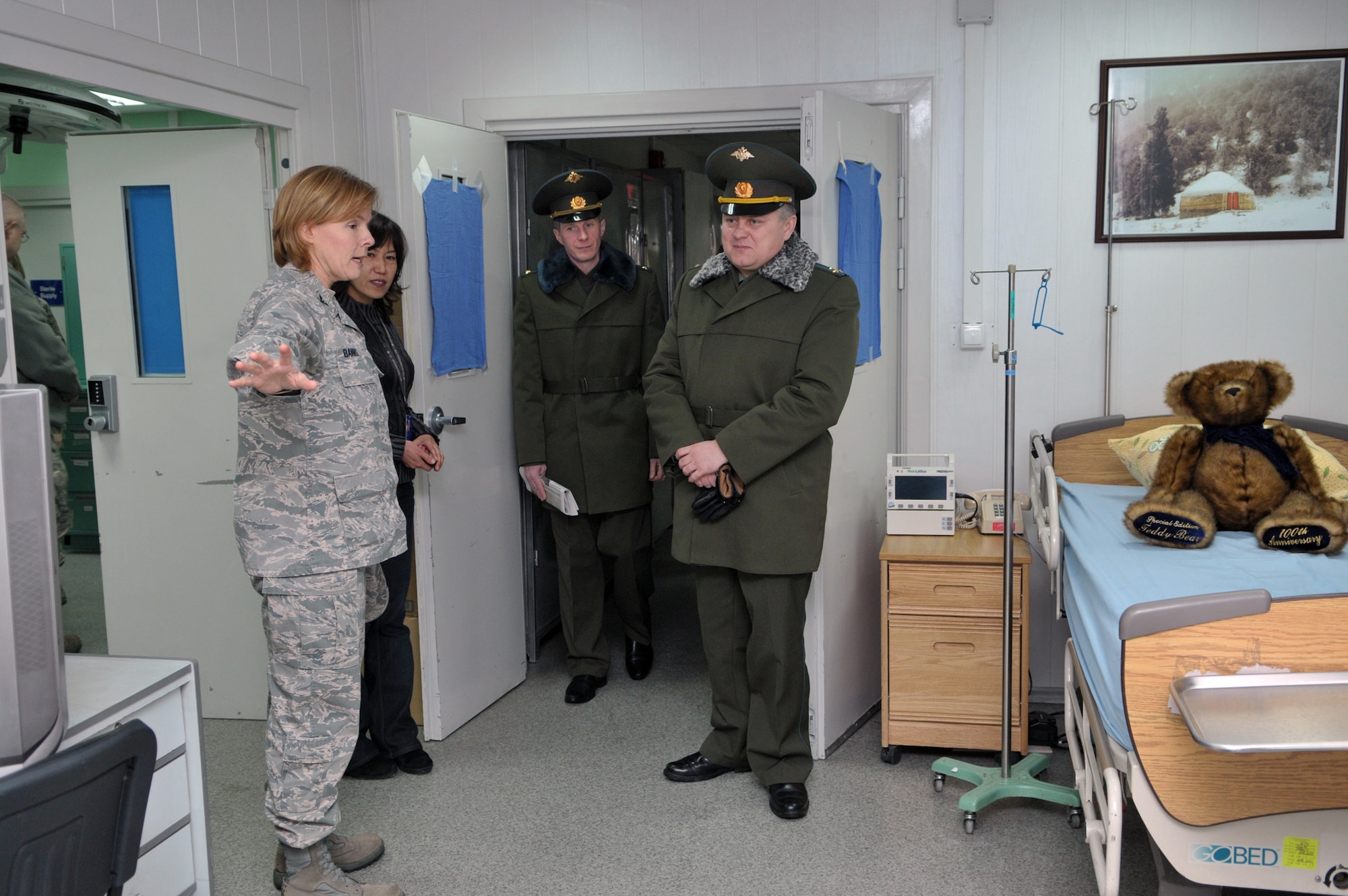TRANSIT CENTER AT MANAS, Kyrgyzstan - Members from the Transit Center give a tour of the medical clinic to Russian Air Force personnel from Kant Air Base. This is the first time in Transit Center history that personnel from Kant have toured here. This visit gave the Kant Airmen a glimpse of the daily U.S. Military life and operations. (U.S. Air Force photo/Staff Sgt. Stacy Moless)
