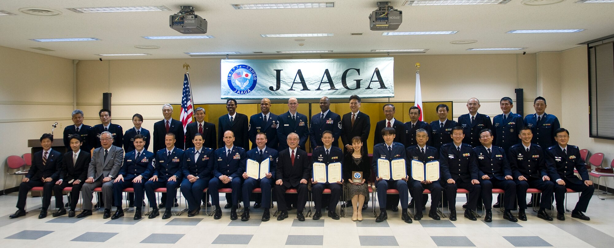 IRUMA AIR BASE, Japan – Members from the 374th Maintenance Group, Yokota Air Base, Japan Air Self-Defense Force and Japan-America Air Force Goodwill Association pose for a group photo at the JAAGA award ceremony here Feb. 10. JAAGA was formed in 1996 by JASDF officials to strengthen ties between Japanese and U.S. cultures.  (U.S. Air Force photo/Staff Sgt. Chad Strohmeyer)
