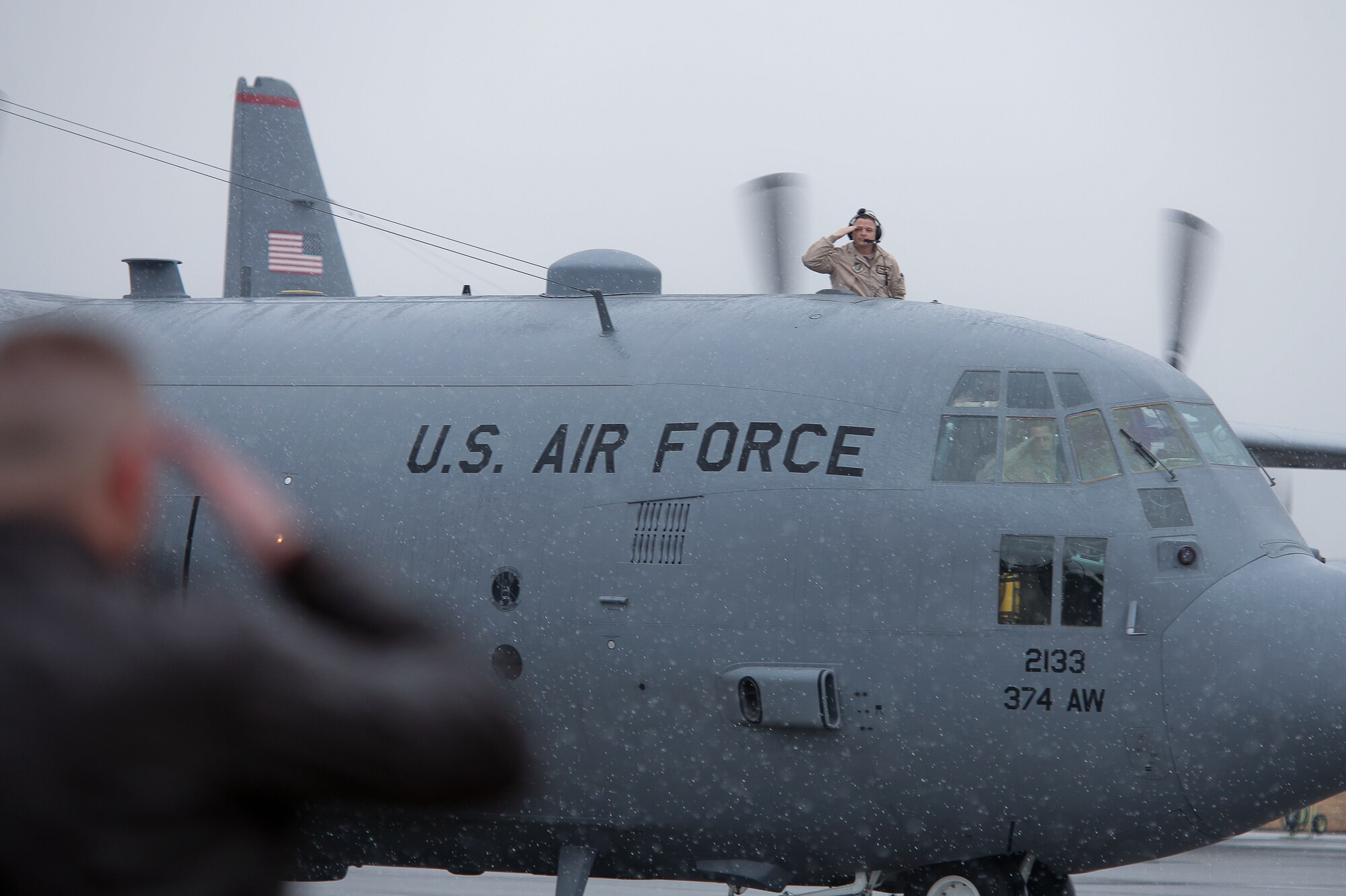 YOKOTA AIR BASE, Japan -- Leaders from the 374th Airlift Wing salute personnel from the 36th Airlift Squadron, 374th Operation Support Squadron and 374th Logistics Readiness Squadron prior to their deployment to Southwest Asia Feb. 9. (U.S. Air Force photo/Osakabe Yasuo) 