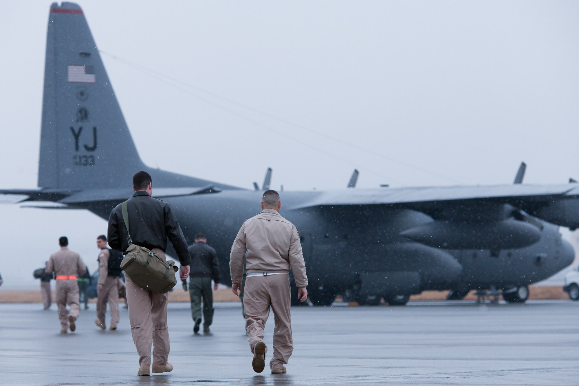 YOKOTA AIR BASE, Japan -- Aircrew members from the 36th Airlift Squadron board a C-130 Hercules, Feb. 9, for a deployment to Southwest Asia. Members from the 36th AS, 374th Operations Support Squadron and 374th Logistics Readiness Squadron deploy to Southwest Asia. (U.S. Air Force photo/Osakabe Yasuo)