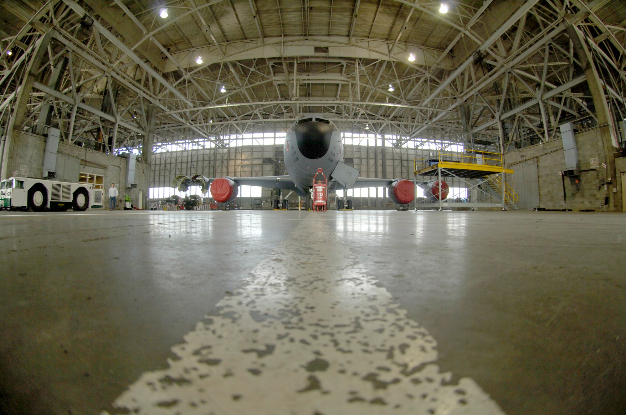 A KC-135 Stratotanker sits in a hangar while its engine is repaired by Fairhchild aircraft maintenance Airmen Feb. 8, 2011 at Grant County International Airport in Moses Lake, Wash. Fairchild maintainers are working in this location on two week rotations while repairs are made to the base’s runway. (U.S. Air Force photo/ Senior Airman Natasha E. Stannard)