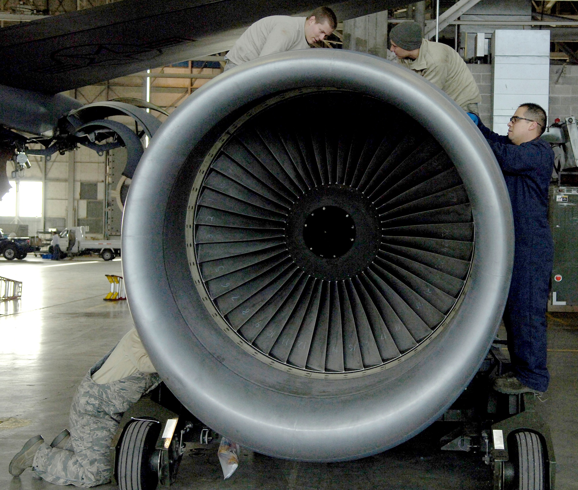 Airmen with the 92nd Aircraft Maintenance Squadron repair a KC-135 Stratotanker engine that was hit by a bird while in flight Feb. 8, 2011 at Grant County International Airport in Moses Lake, Wash. Earlier, the Airmen worked to remove the engine from the wing so they could perform in-depth maintenance on the part.  Fairchild flying operations are scheduled to continue out of Grant County International Airport until November, which is when repairs to Fairchild’s runway are expected to be finished. (U.S. Air Force photo/ Senior Airman Natasha E. Stannard)