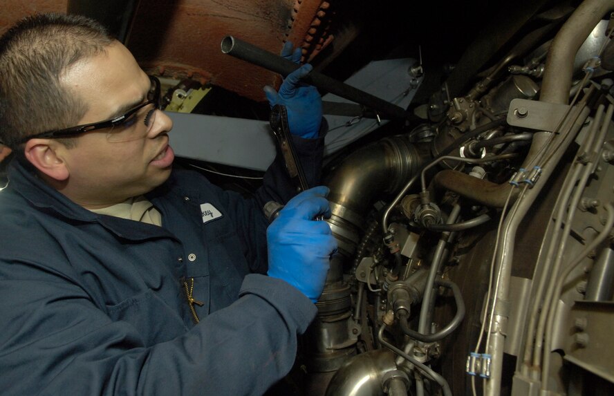 Tech. Sgt. Michael Auguilera, 141st Aircraft Maintenance Squadron maintainer, prepares an engine to be removed from the wing of a KC-135 Stratotanker on Feb. 8, 2011 at Grant County International Airport in Moses Lake, Wash. The engine was being repaired due to a bird strike. Once Airmen removed the engine they made additional repairs to it. (U.S. Air Force Photo/Senior Airman Natasha E. Stannard) 