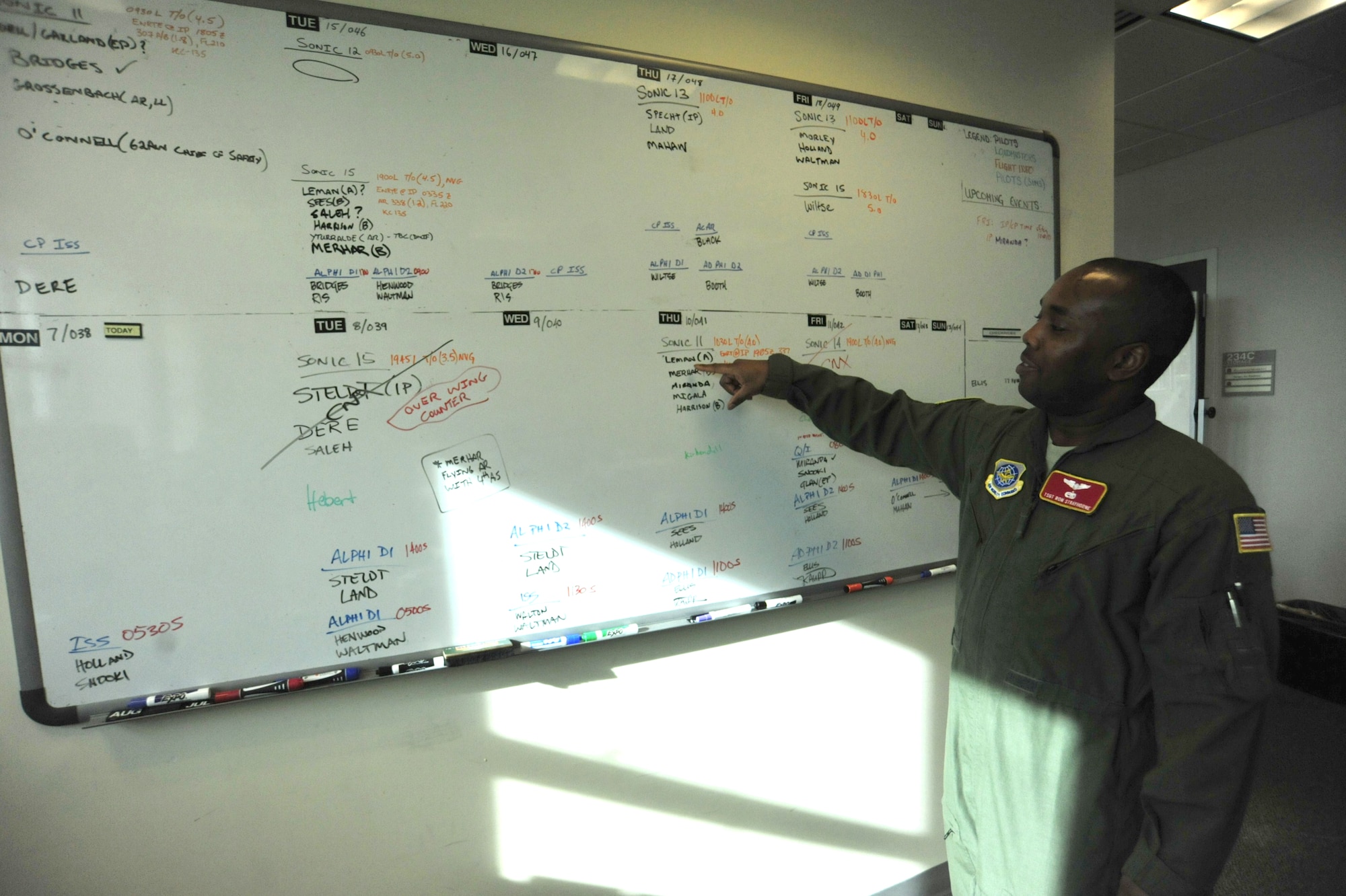 Technical Sgt. Ron Strayhorne, 10th Airlift Squadron loadmaster, describes the mission scheduling system for the 10th AS Feb. 9 at Joint Base Lewis-McChord, Wash. Airmen are scheduled for flying missions based on availability, current training and qualification. (U.S. Air Force photo/Airman 1st Class Leah Young)