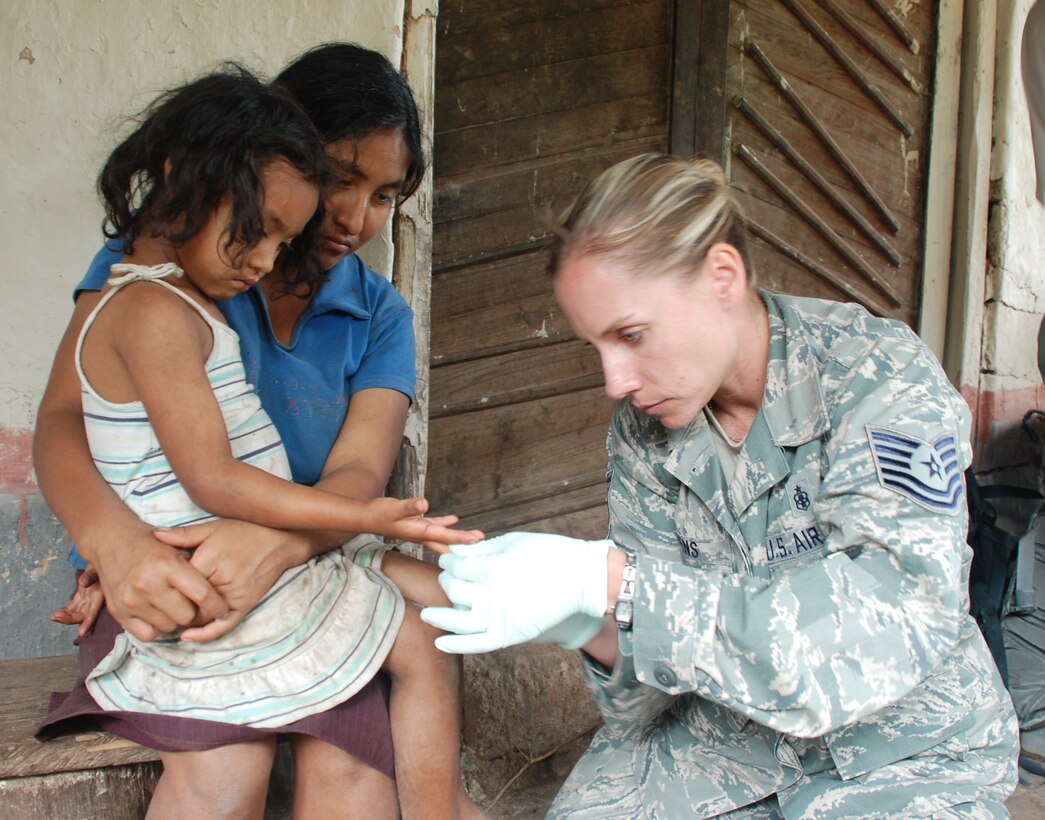 SOTO CANO AIR BASE, Honduras - Tech. Sgt. Annette Owens, Joint Task Force-Bravo Medical Element tecnician, draws a blood sample from a child during a medical readiness training exercise in Montana de la Flor Jan. 29.   Samples were drawn from randomly selected children and nursing mothers to detect nutritional deficiencies in the local population.  The results will be reported to the Honduran Ministry of Health for use in improving basic health programs.  (U.S. Air Force photo/Capt. John T. Stamm)