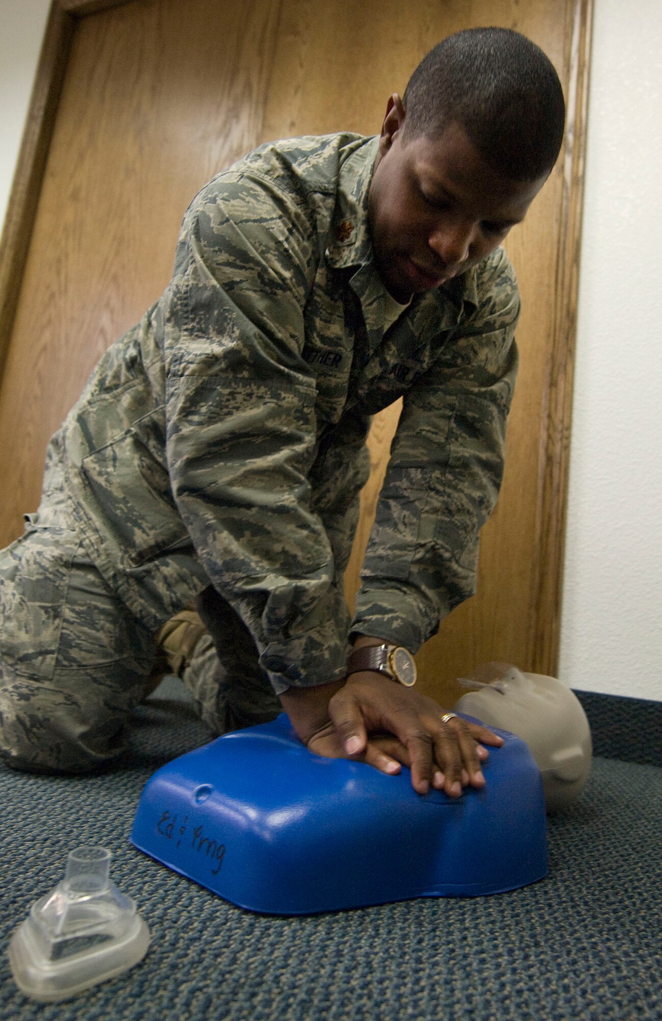 NELLIS AIR FORCE BASE, NEV.-- Maj.Julian Gaither, 99th Air Base Wing chaplain, simulates chest compressions during a heart savers course Feb. 2. The course kicked-off the beginning of automated external defibrillators being placed in public areas around the base. (U.S Air Force photo by Senior Airman Stephanie Rubi)