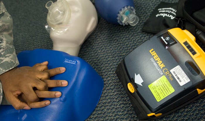 NELLIS AIR FORCE BASE, NEV.-- Capt. Paul Amaliri, 99th Air Base Wing chaplain, simulates chest compressions during a heart savers course Feb 2. The course kicked-off the beginning of automated external defibrillators being placed in public areas around the base.  (U.S Air Force photo by Senior Airman Stephanie Rubi) 