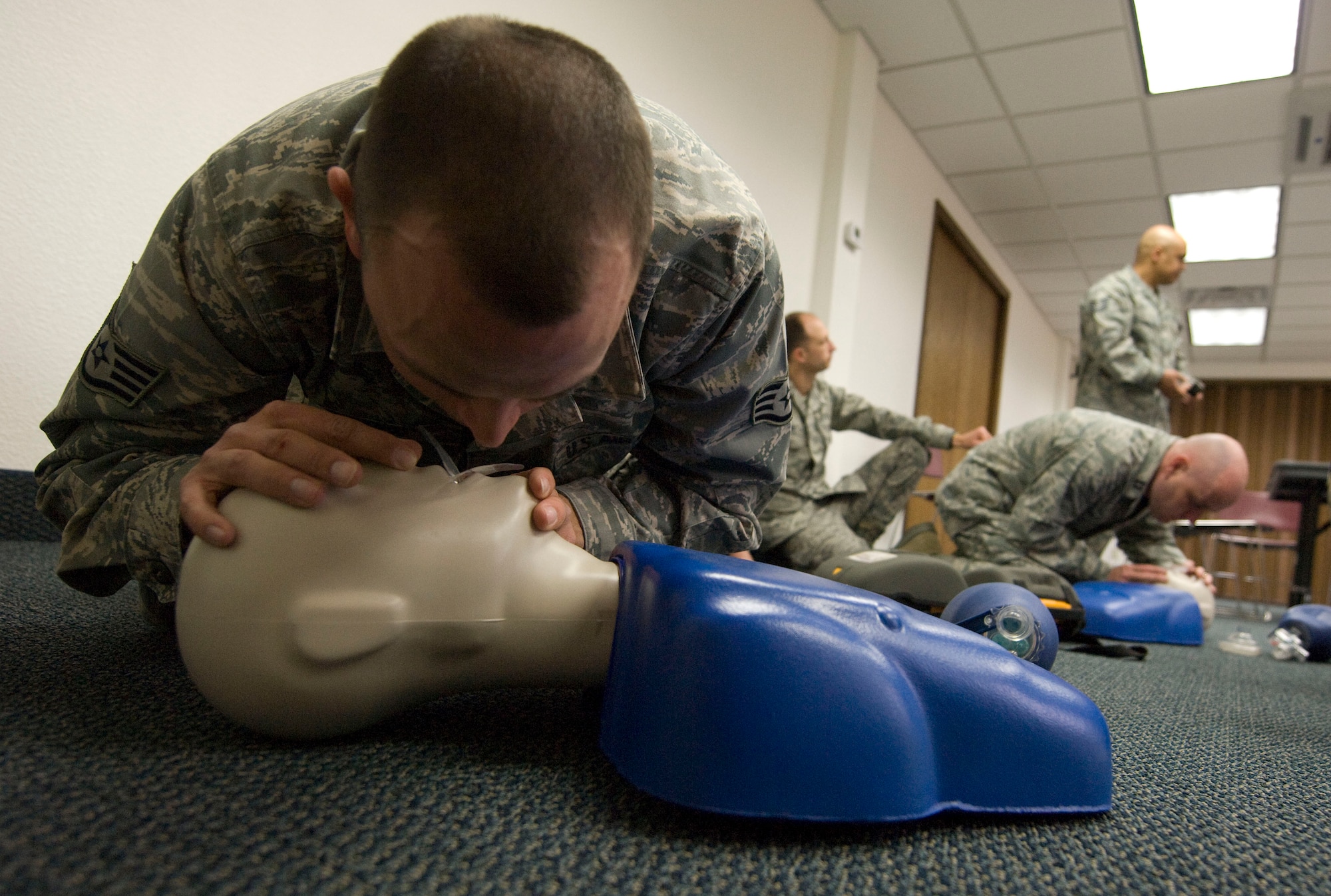 NELLIS AIR FORCE BASE, NEV.-- Staff Sgt. Charles Woford, 99th Air Base Wing chaplains assistant, simulates performing mouth-to-mouth resuscitation during a heart saver course Feb. 2. The course kicked-off the beginning of automated external defibrillators being placed in public areas around the base.  (U.S Air Force photo by Senior Airman Stephanie Rubi)