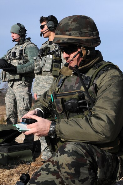Slovenian army Staff Sgt. Rudolf Rot tracks current position coordinates during a NATO coalition combat capability training exercise at Pocek Range Feb. 3, 2011, in Postojna, Slovenia. The exercise consisted of close-air-support training between Airmen from Aviano Air Base, Italy, and Slovenian army joint terminal attacks controllers and tactical air control party operators, as well as Slovenian PC-9M aircrews. Sergeant Rot is a 1st Brigade tactical air control party operator. (U.S. Air Force photo/Staff Sgt. Nadine Y. Barclay) 