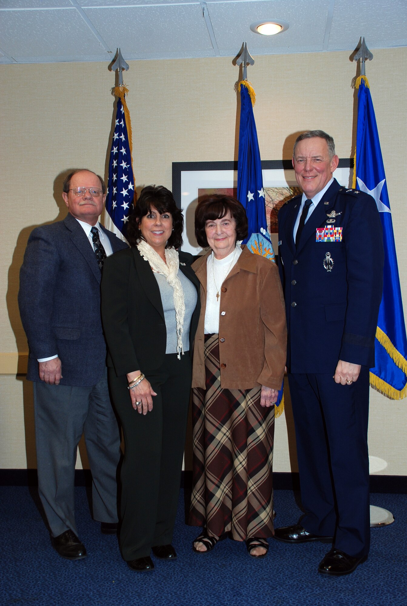 Cheyenne's Mayor Rick Kaysen, Maj. Gen. C. Donald Alston, 20th AF commander and wife Ana, pose for a photo with Mrs. Irene Johnigan, president of local AFA Cowboy Chapter #357, at the Community Partners Recognition Luncheon in Cheyenne Feb. 8. (U.S. Air Force photo by 1st Lt. Brooke Brzozowske)