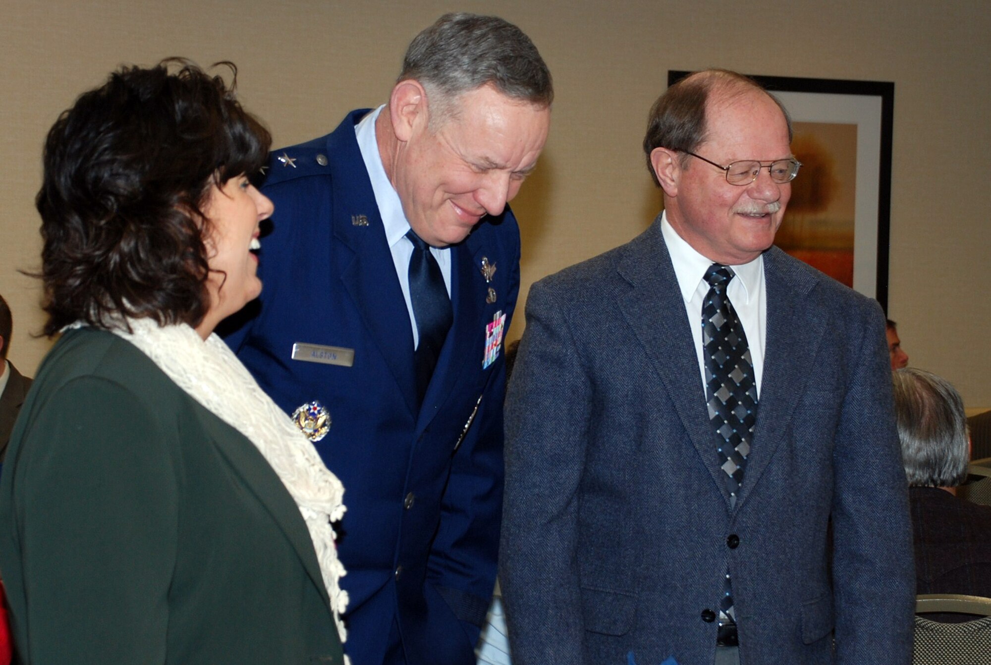 Maj. Gen. C. Donald Alston, 20th Air Force commander, and wife Ana, share a laugh with Cheyenne’s Mayor Rick Kaysen at the Cowboy Chapter of Air Force Association’s Community Partners Recognition Luncheon in Cheyenne Feb. 8. (U.S. Air Force photo by 1st Lt. Brooke Brzozowske)